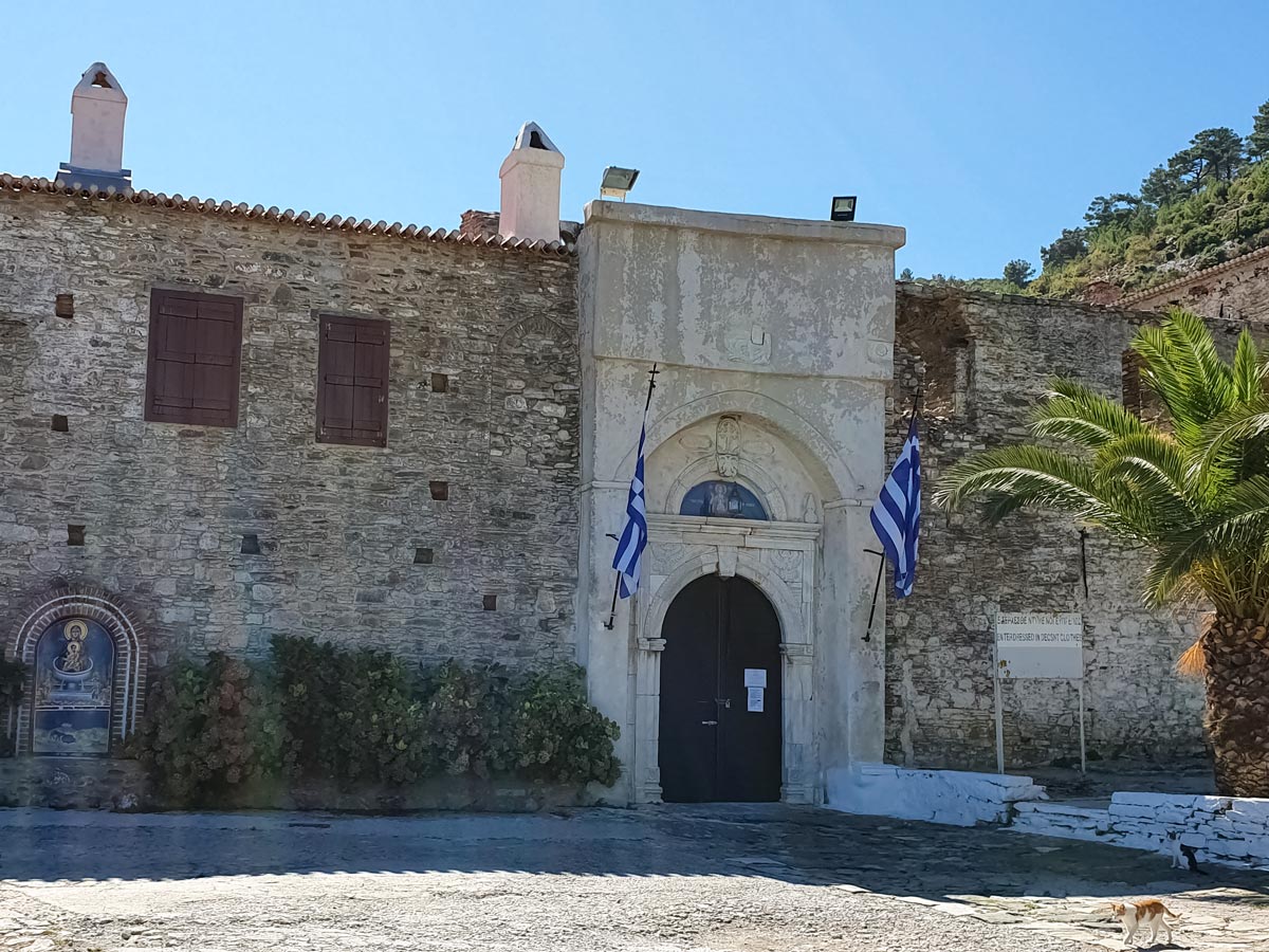 Old stone building greek flags Samos Island Greece walking tour