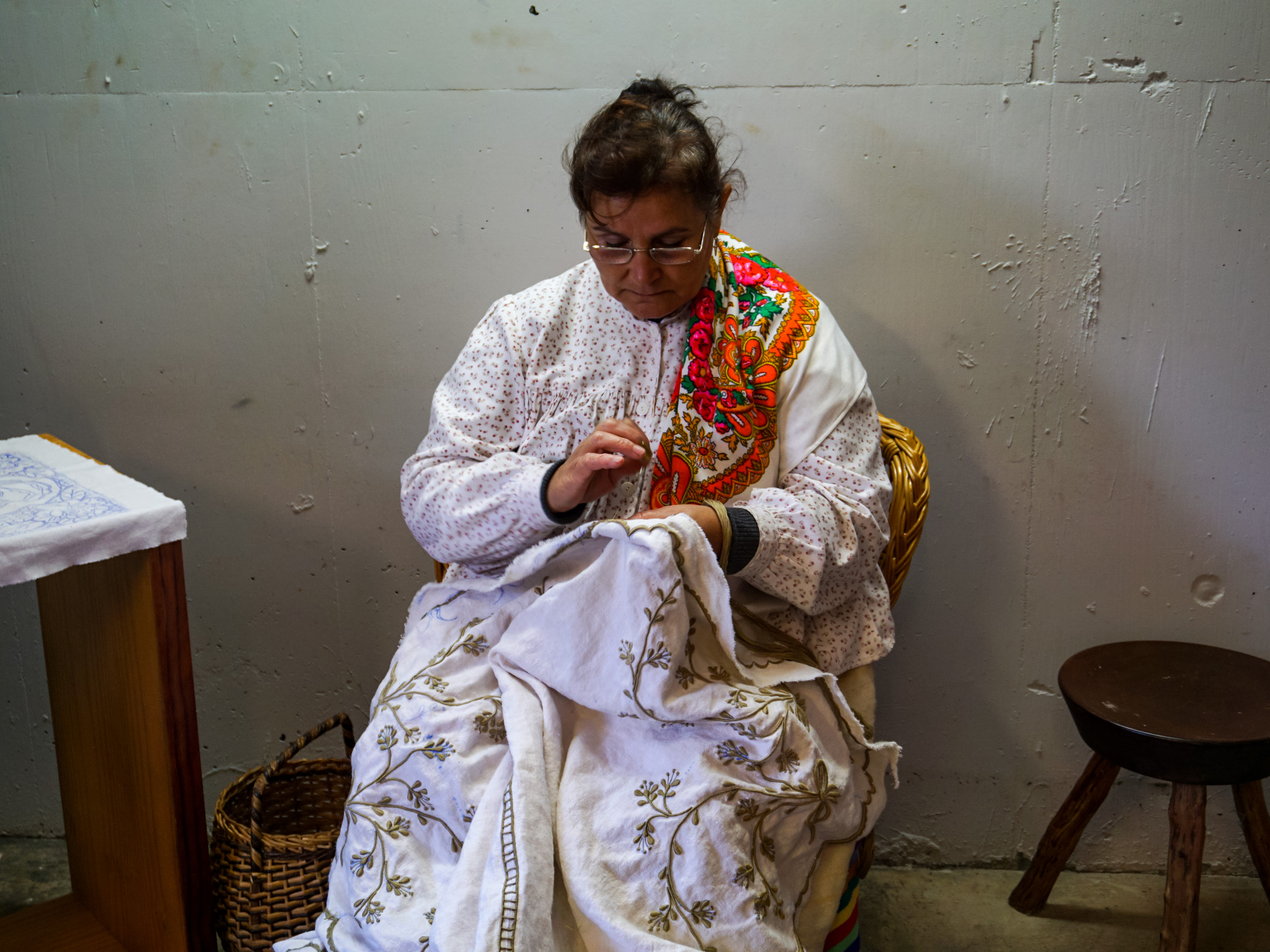 Woman practicing traditional embroidery Maderira Spain