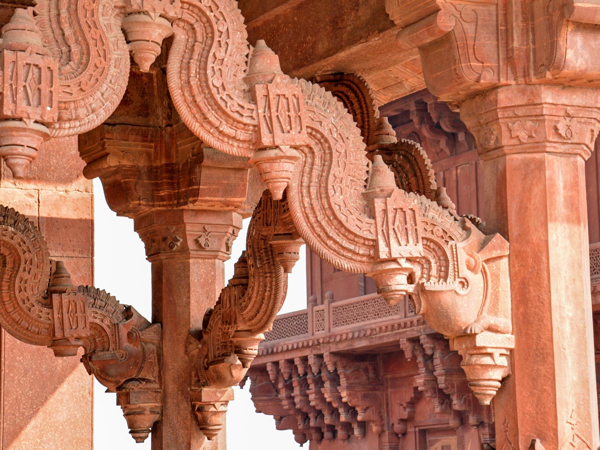 Fatepur Sikri ancient red sandstone carving arcitecture yoga Golden Triangle Himalayas India adventure tour