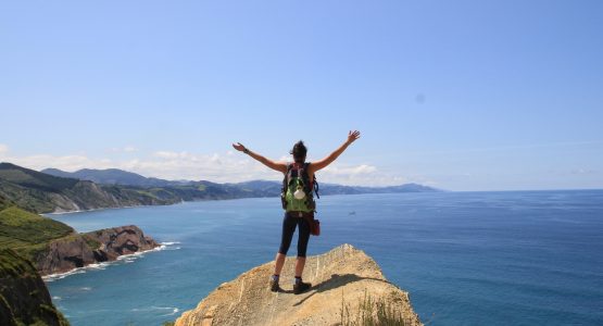 Hiker posing near the coast of Spain