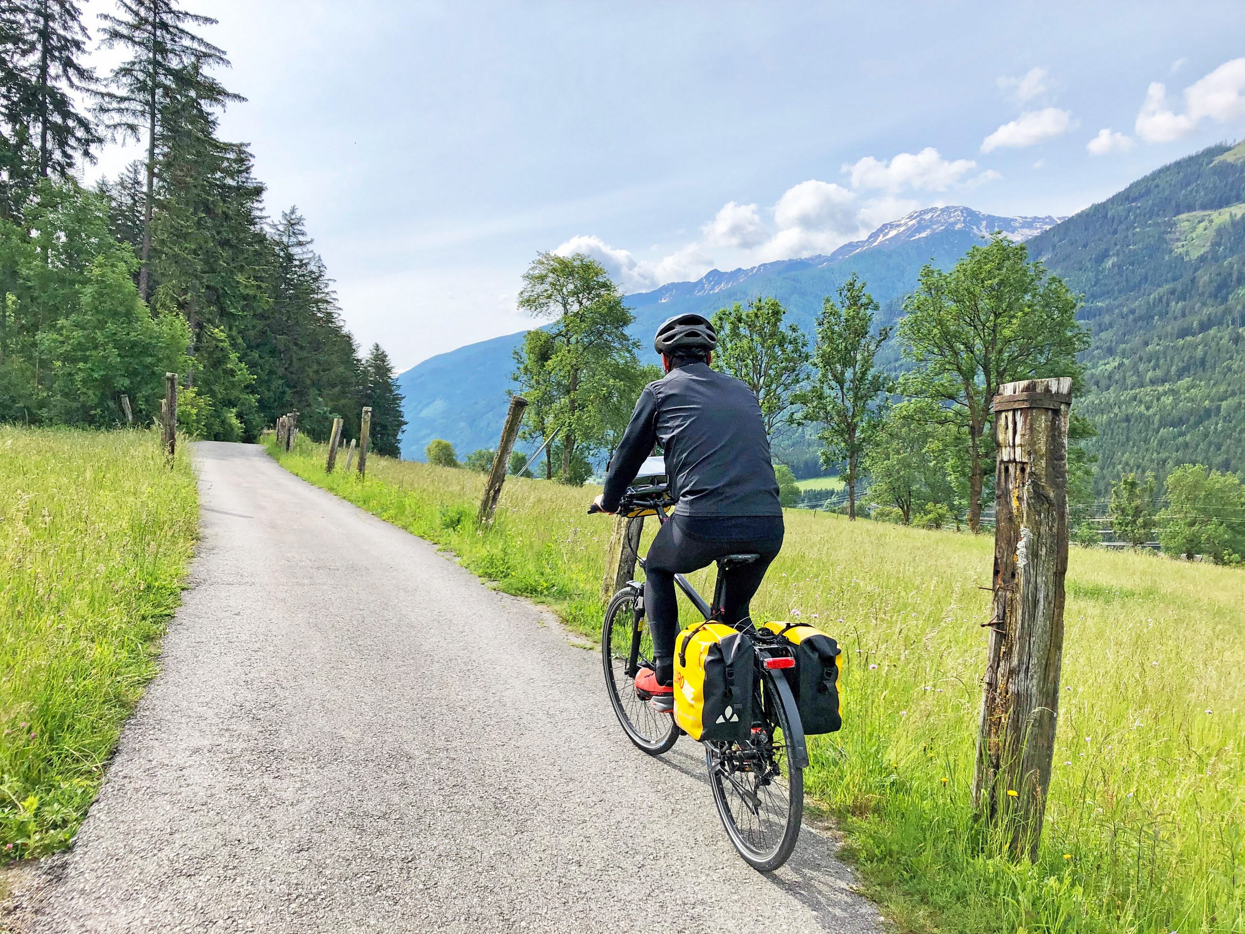 Cyclist biking on a biking path between Salzburg and Villach