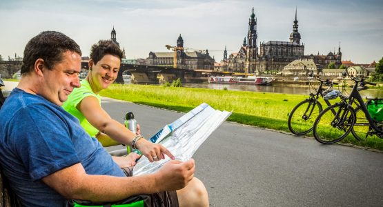 Cyclists looking at map information biking the Elbe cycling trail Prague to Dresden