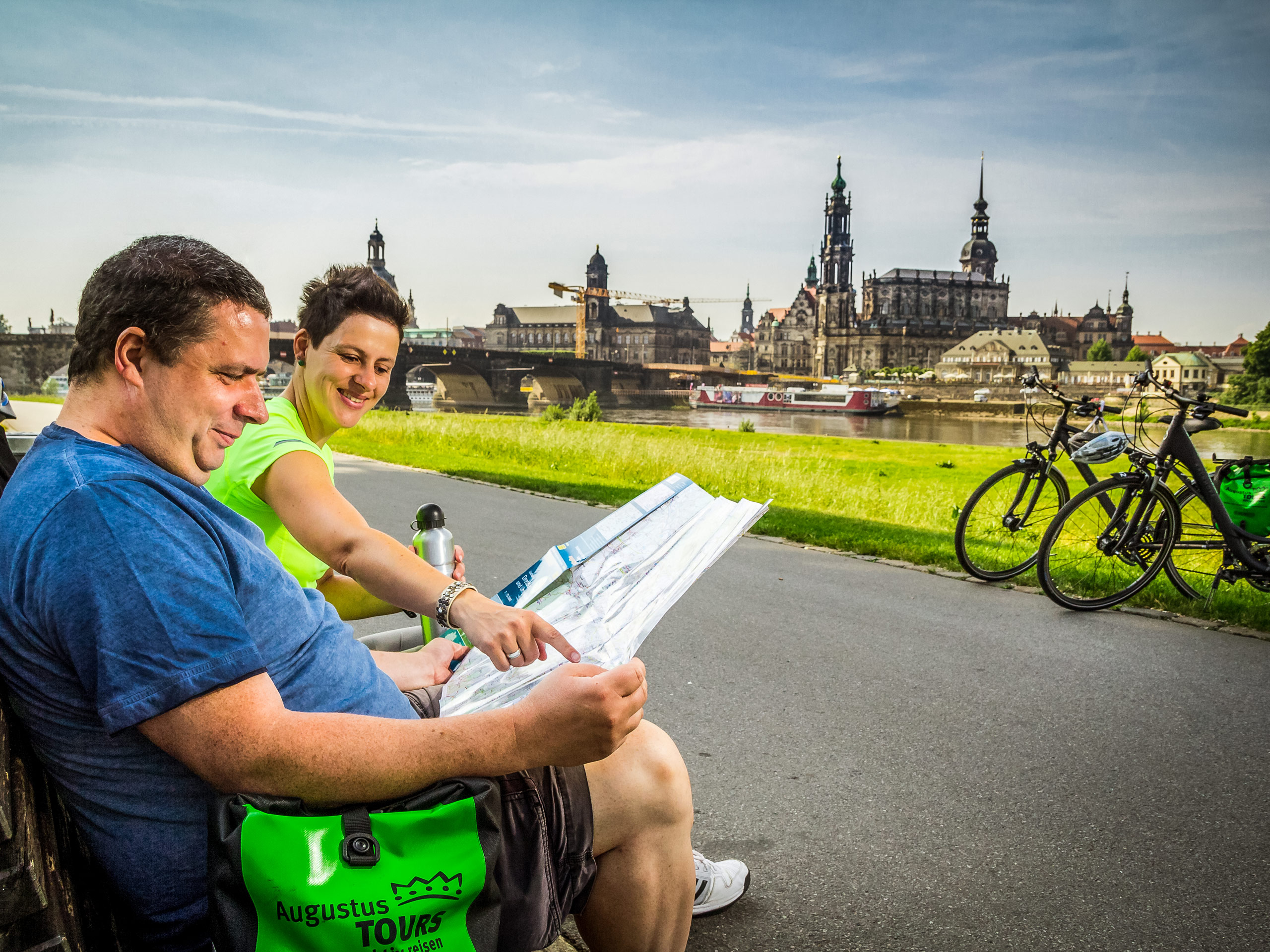 Cyclists looking at map information biking the Elbe cycling trail Prague to Dresden