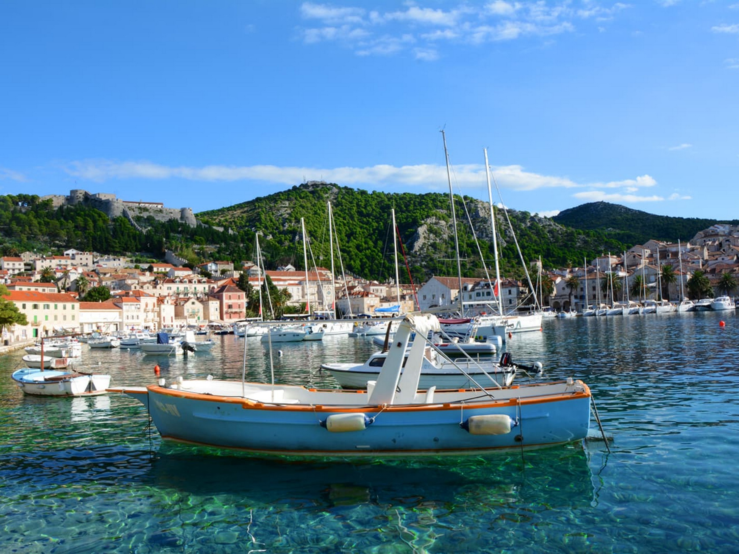 Boat in the turquoise water of the Dalamatian Sea