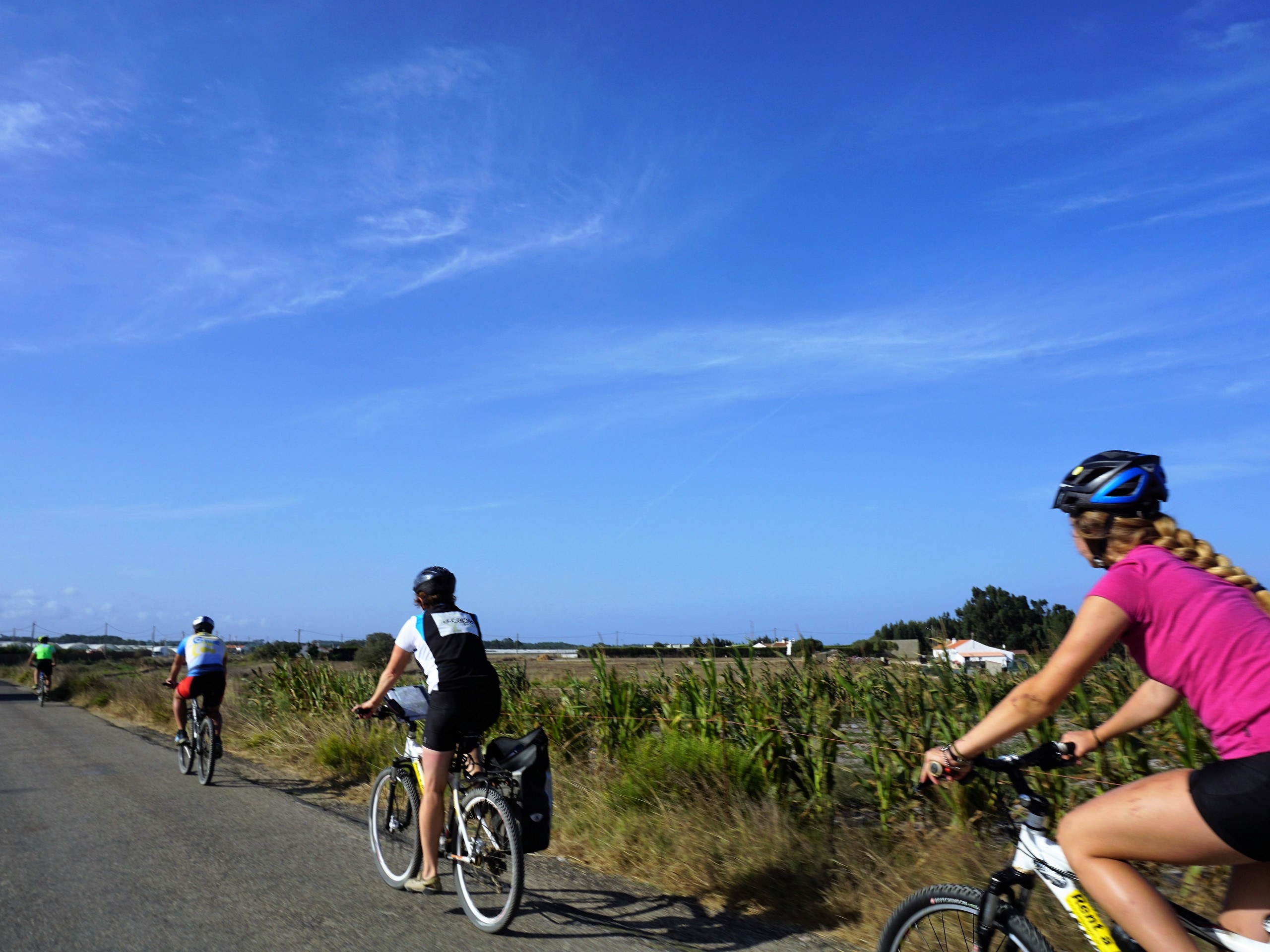 Cyclist biking through fields in Portugal