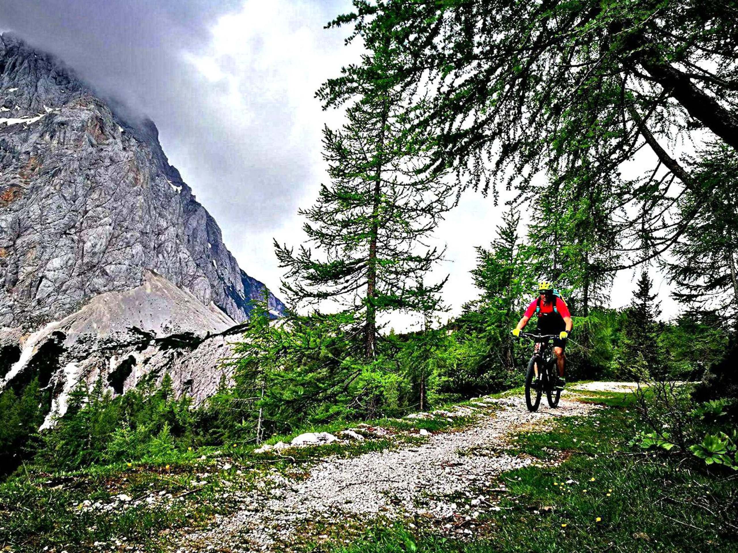 Biker cycling in Slovenian Alps