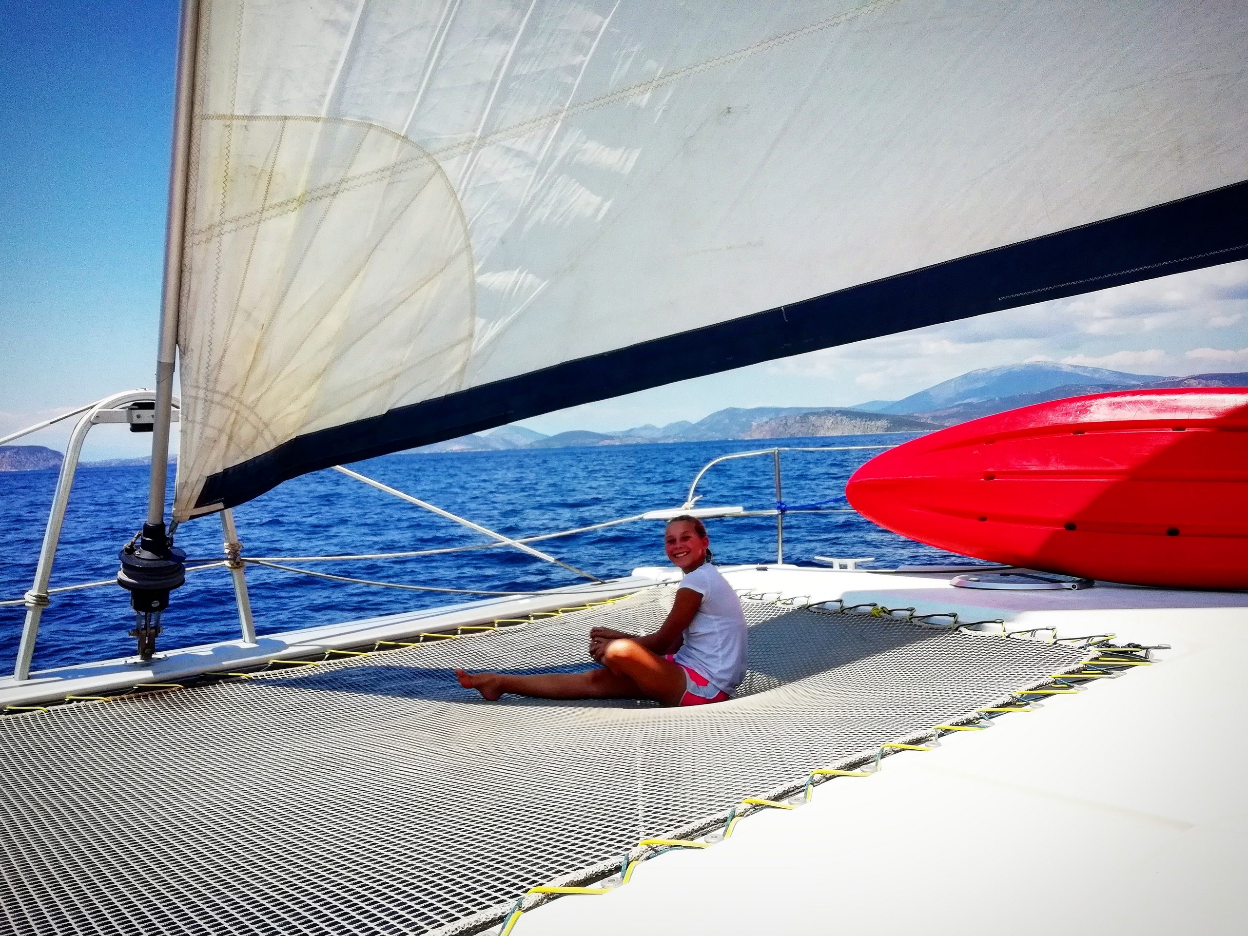 Sun tanning on the deck of the sailboat