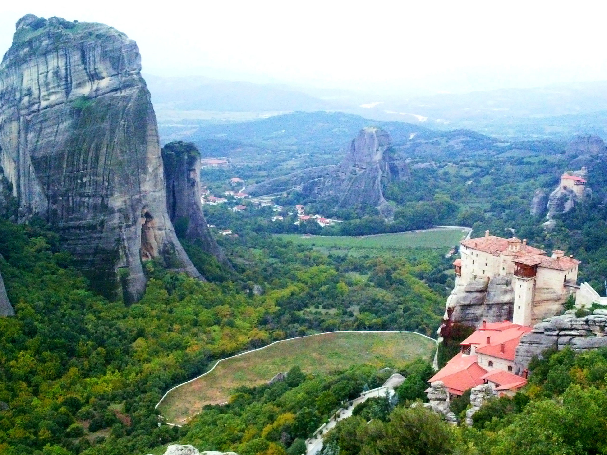 Meteora monastery with a wide valley view below