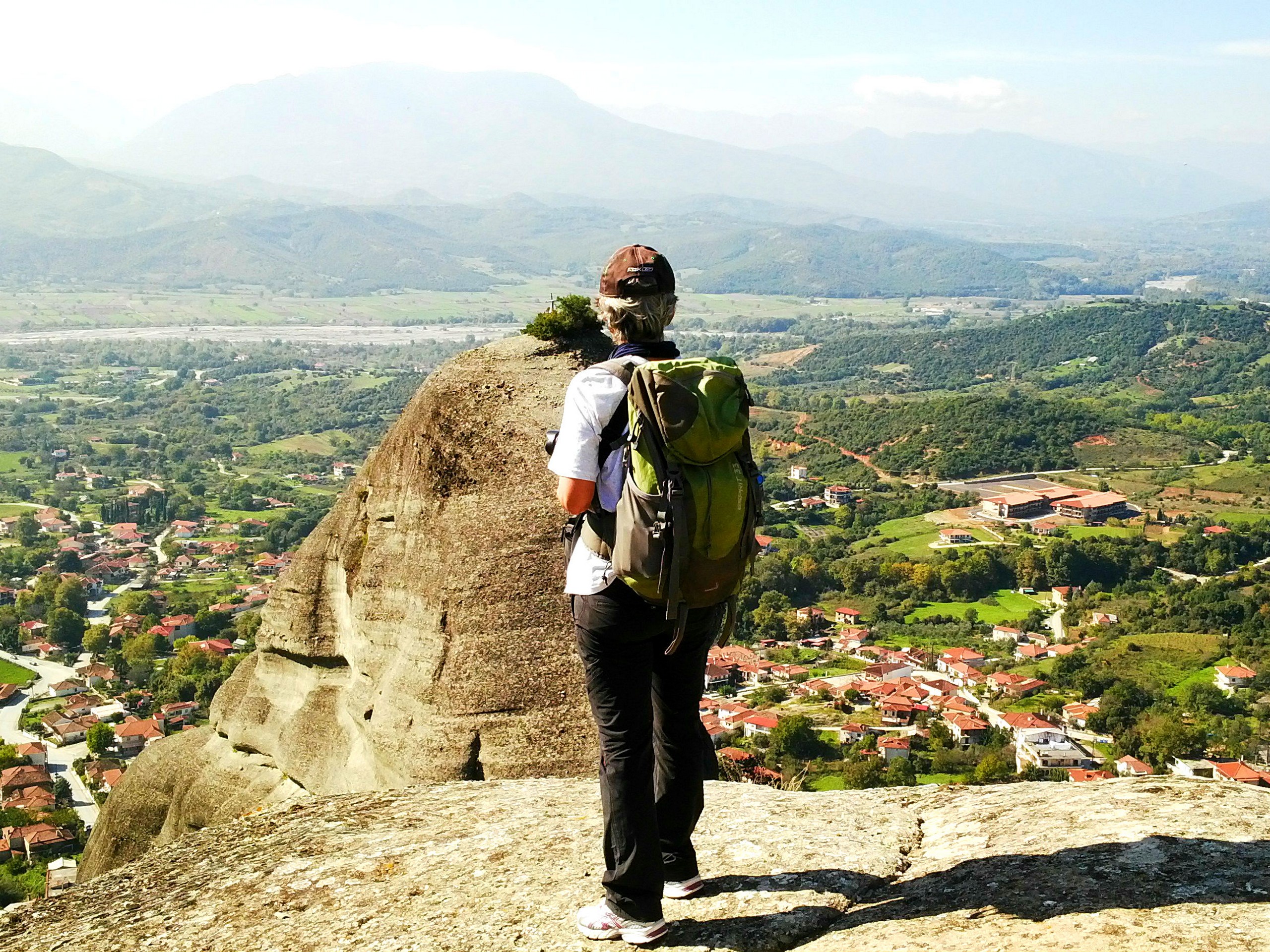 Hiker exploring Meteora rock formations in Greece