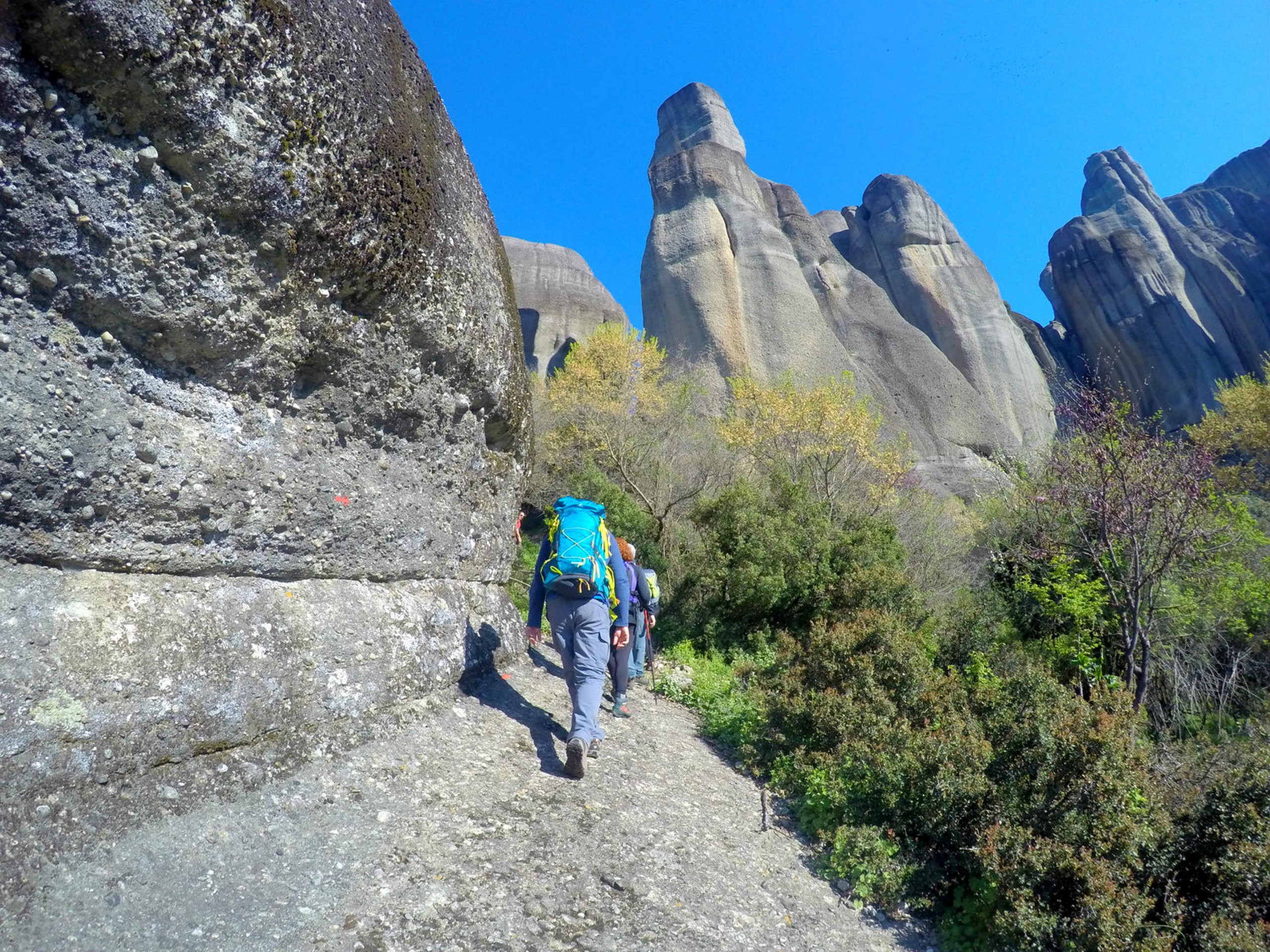 Walking along the rock formations in Meteora, Greece