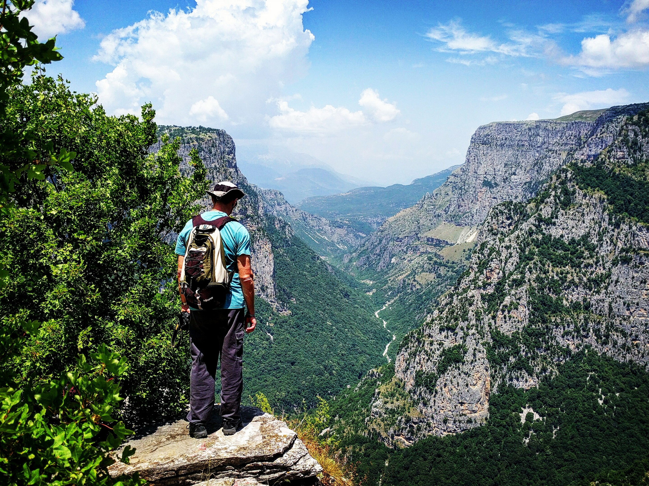 Hiker looking at Vikos Gorge