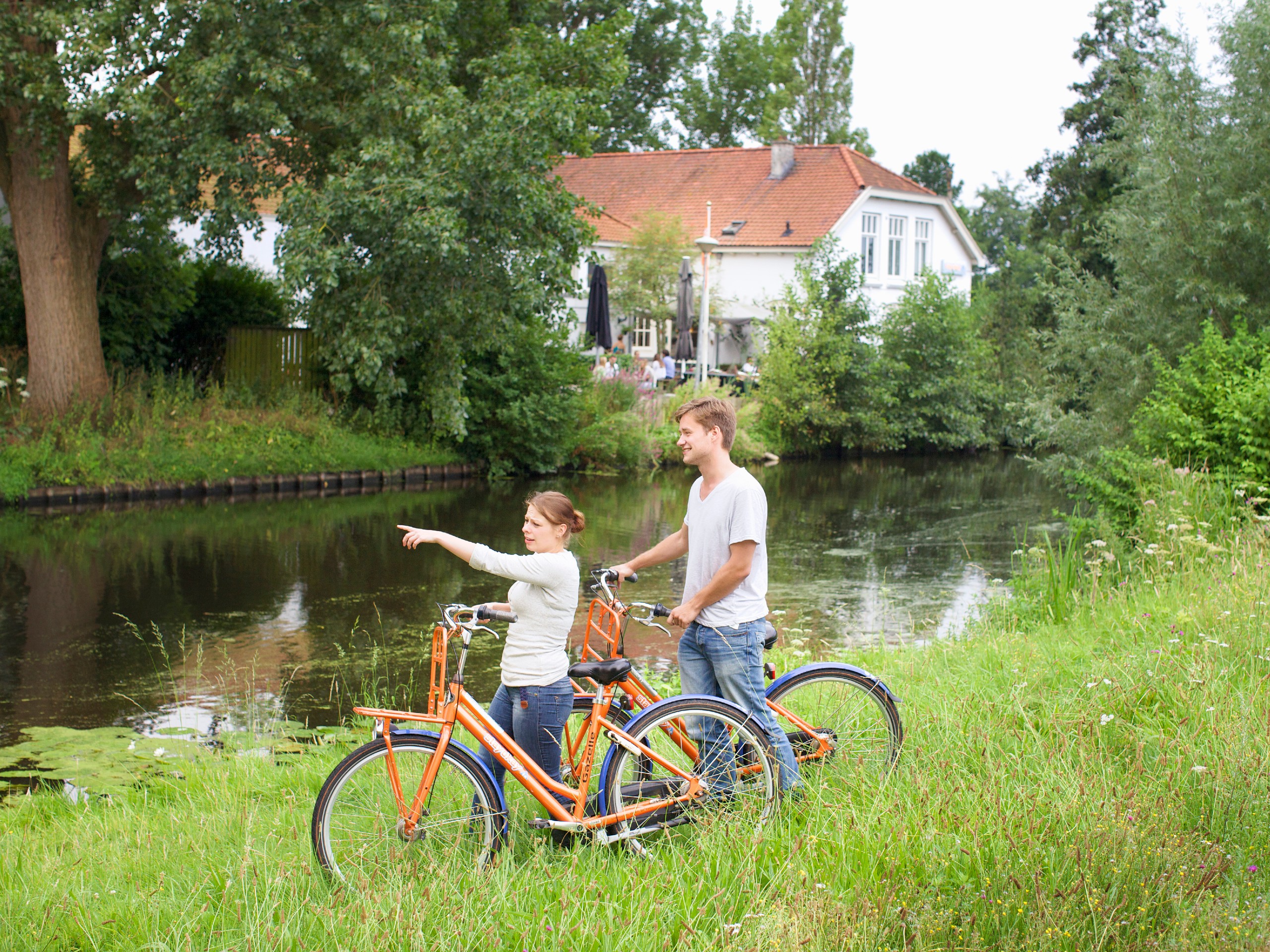 Couple near the river in Haarlem (Netherlands)