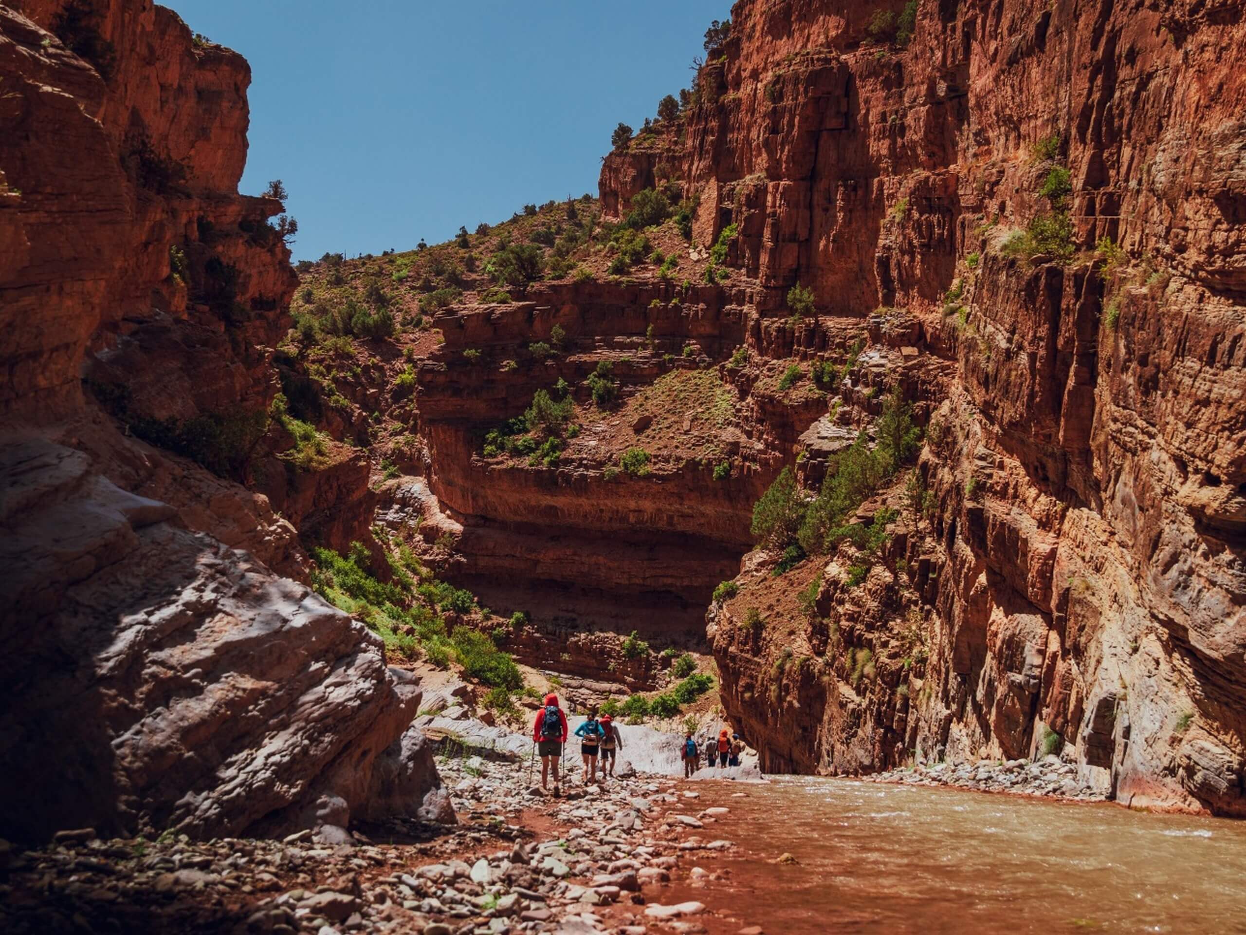 Trekkers walking in the Mgoun Canyon