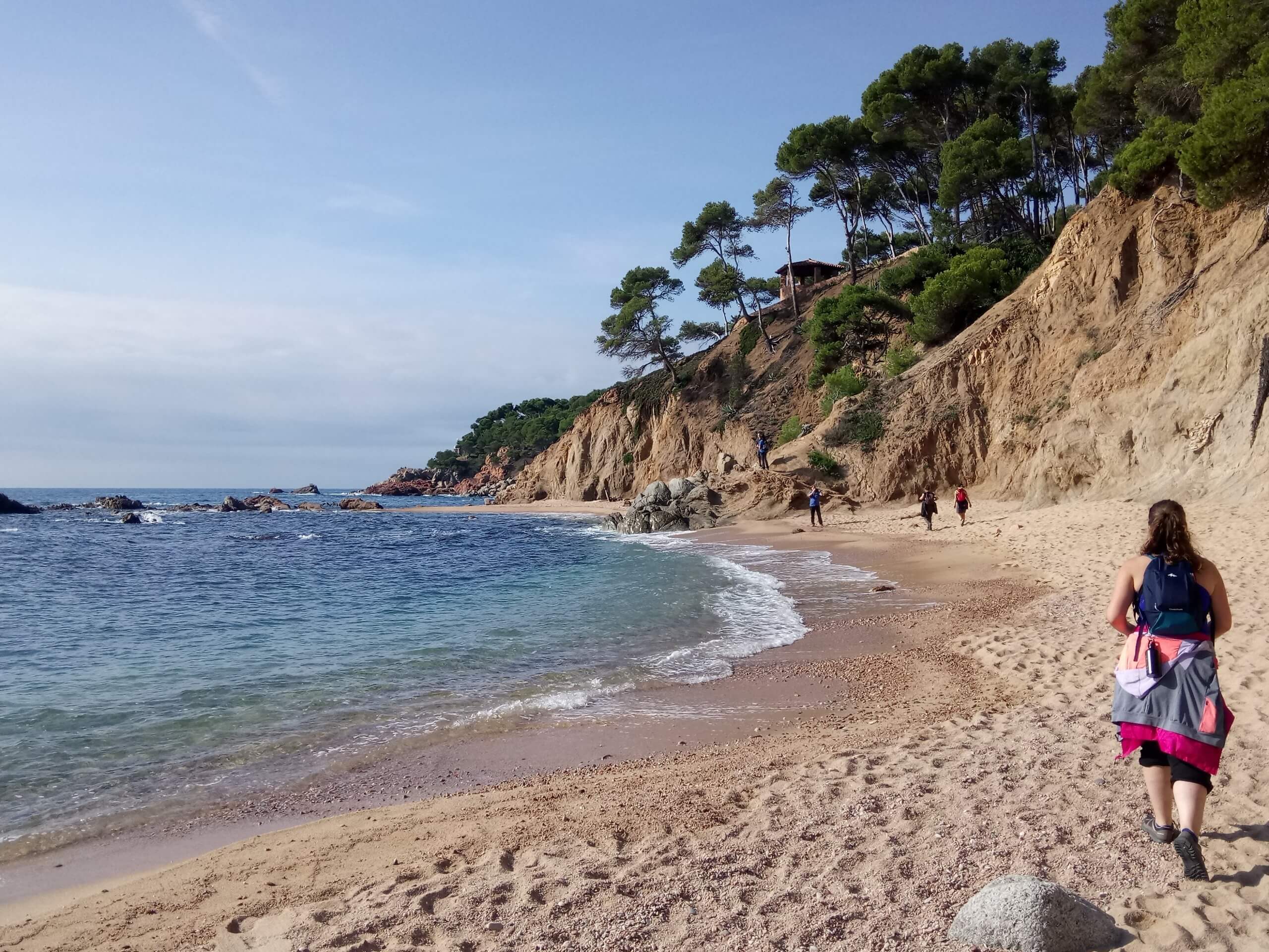 Lady walking along the Costa Brava coast