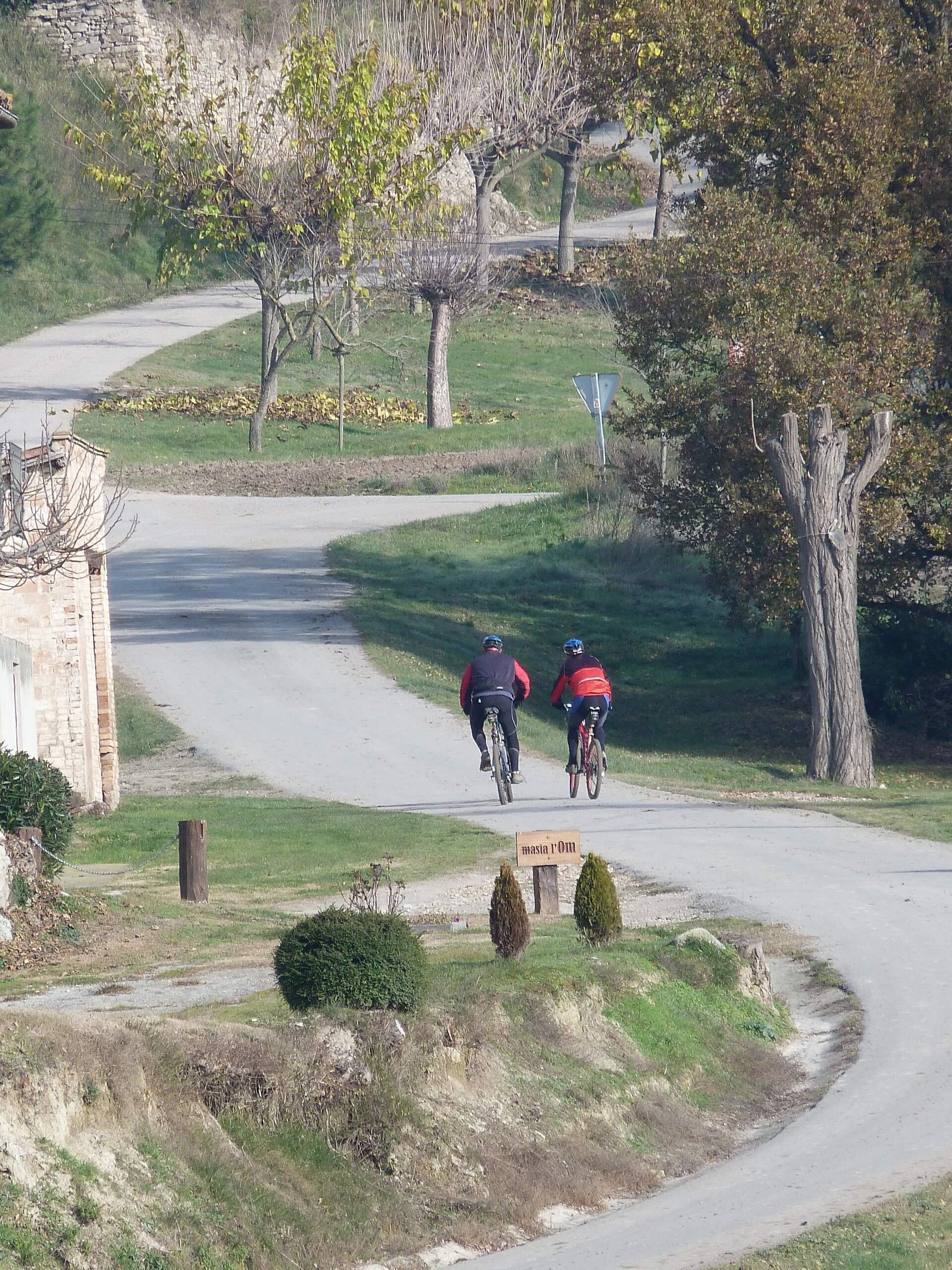 Two bikers riding the cycling path in Catalonia