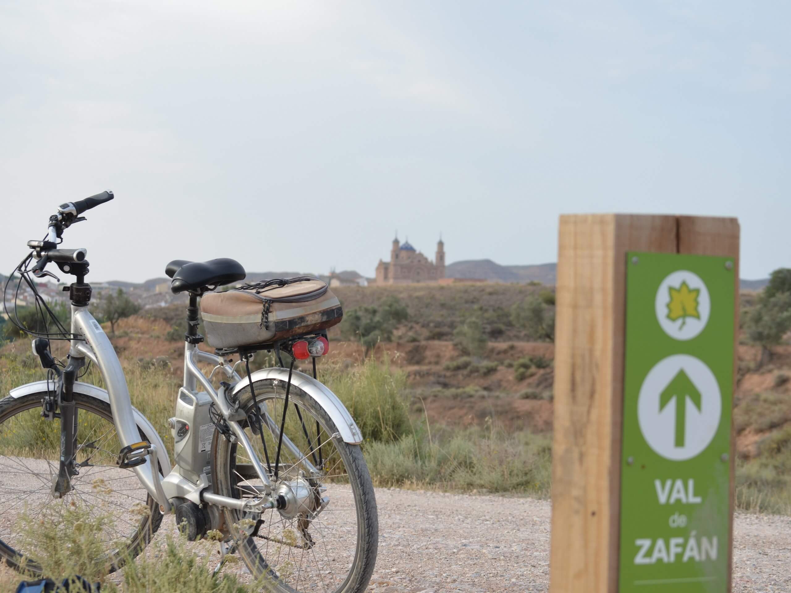 Bike parked near the road sign in Spain