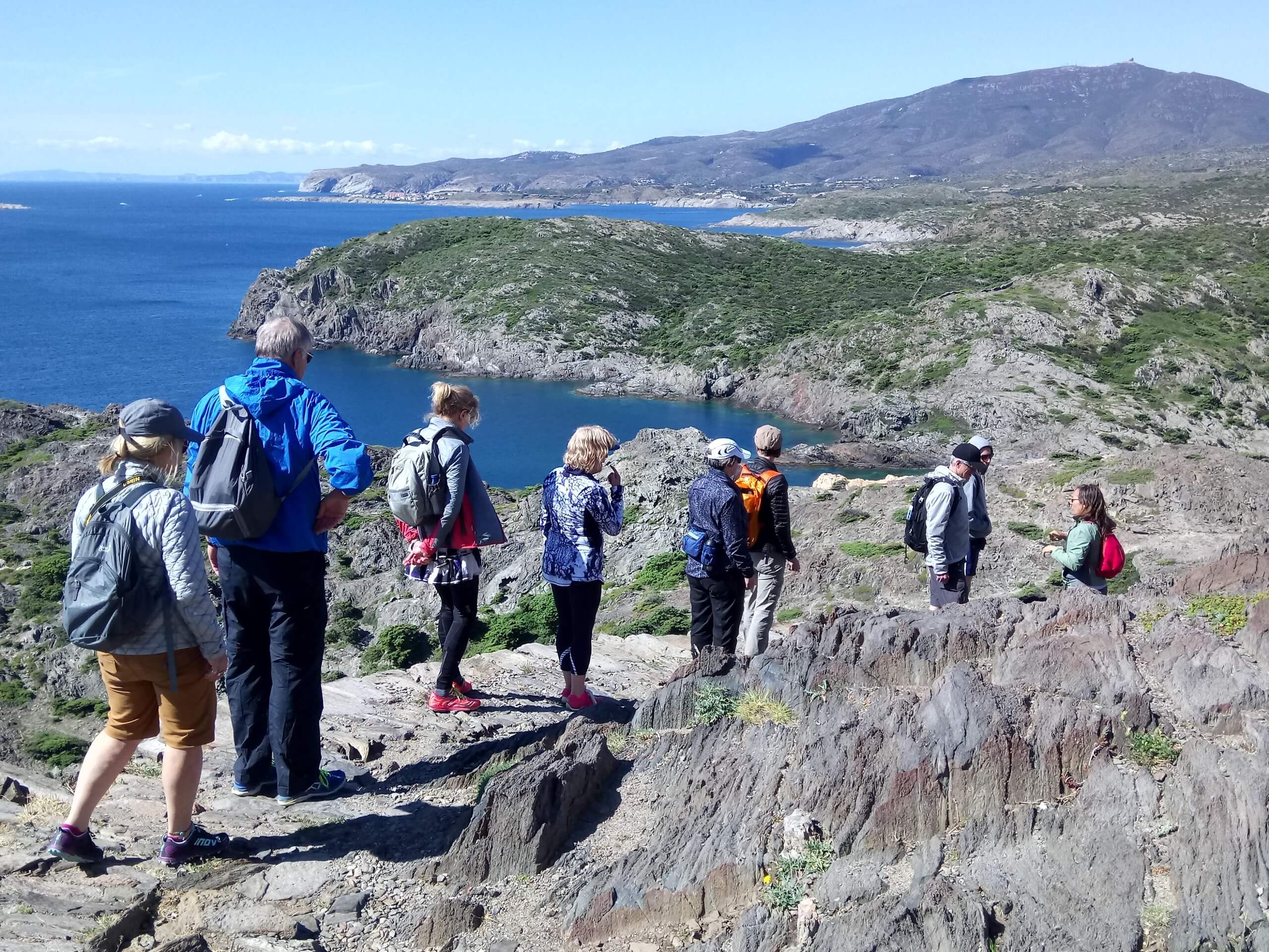 Group of hikers walking along the coast of Costa Brava