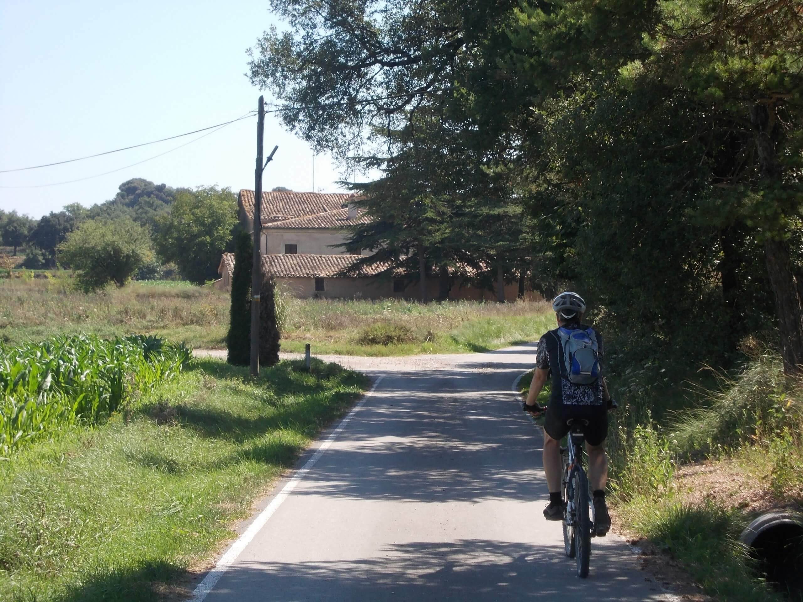 Cyclist riding a path in Spain