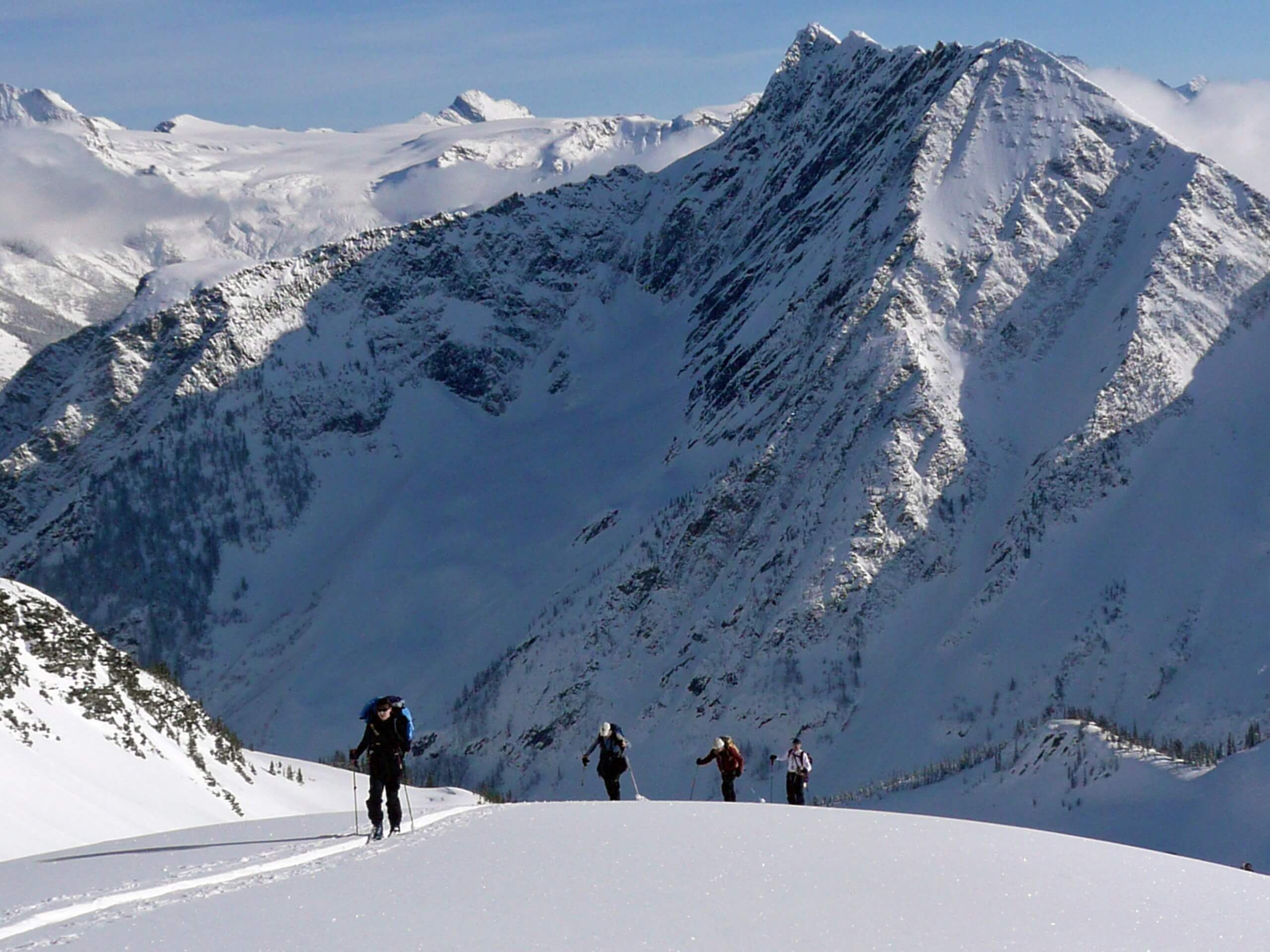 Ascending on snowy peaks while on Avalanche Training course