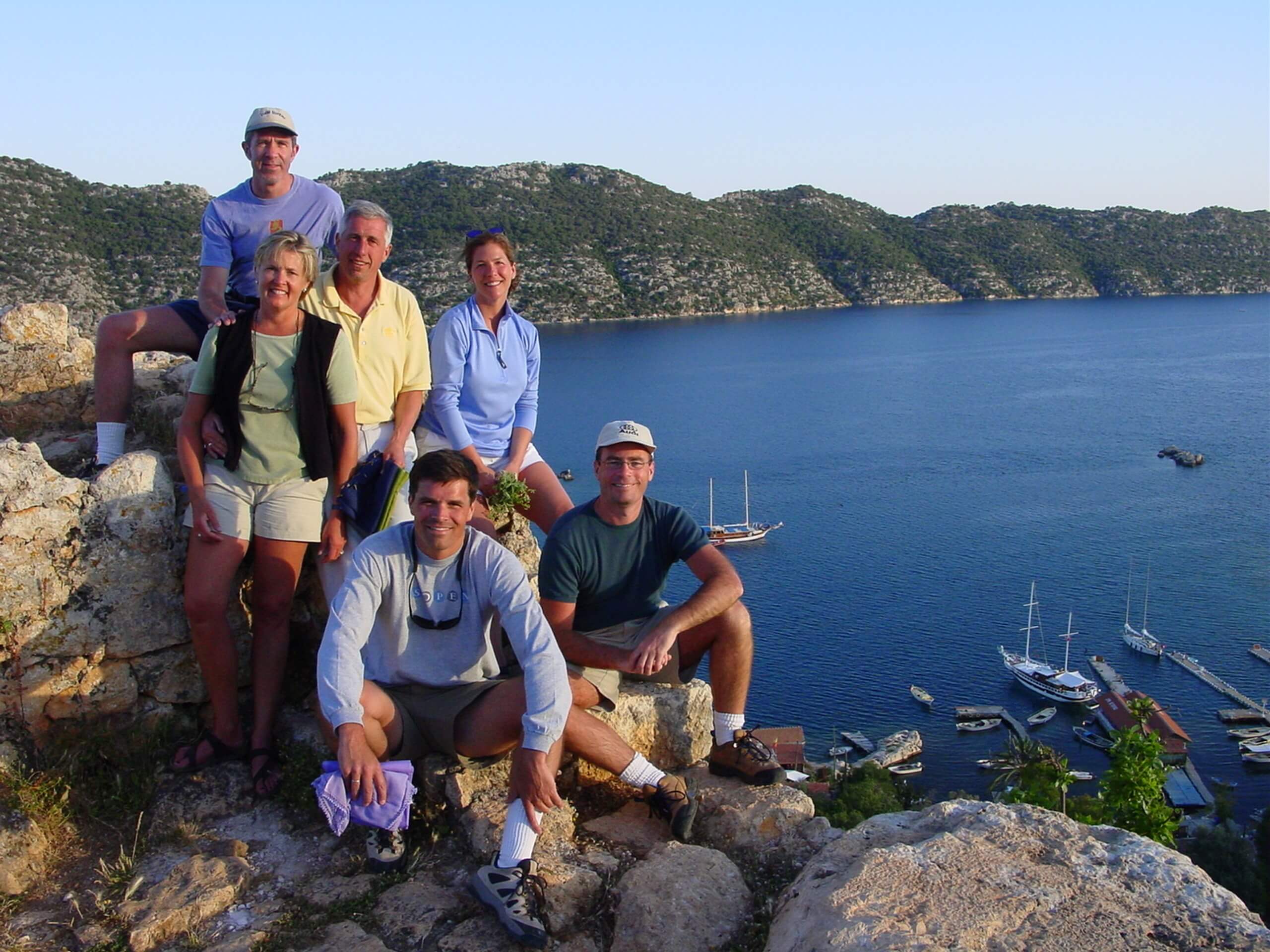 Group of travellers posing near the bay in Southern Turkey