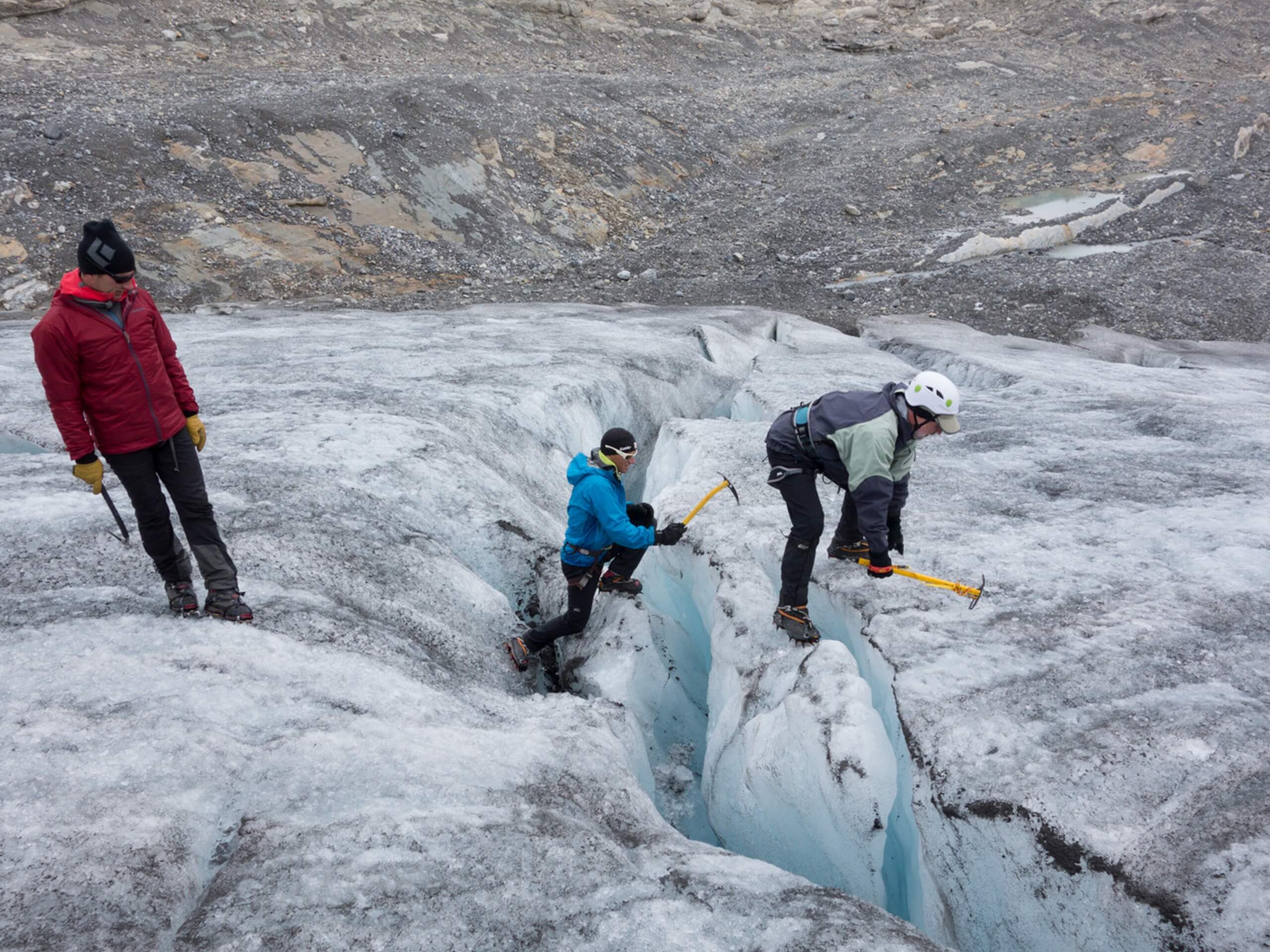 Group of climbers learning to cross the crevasse