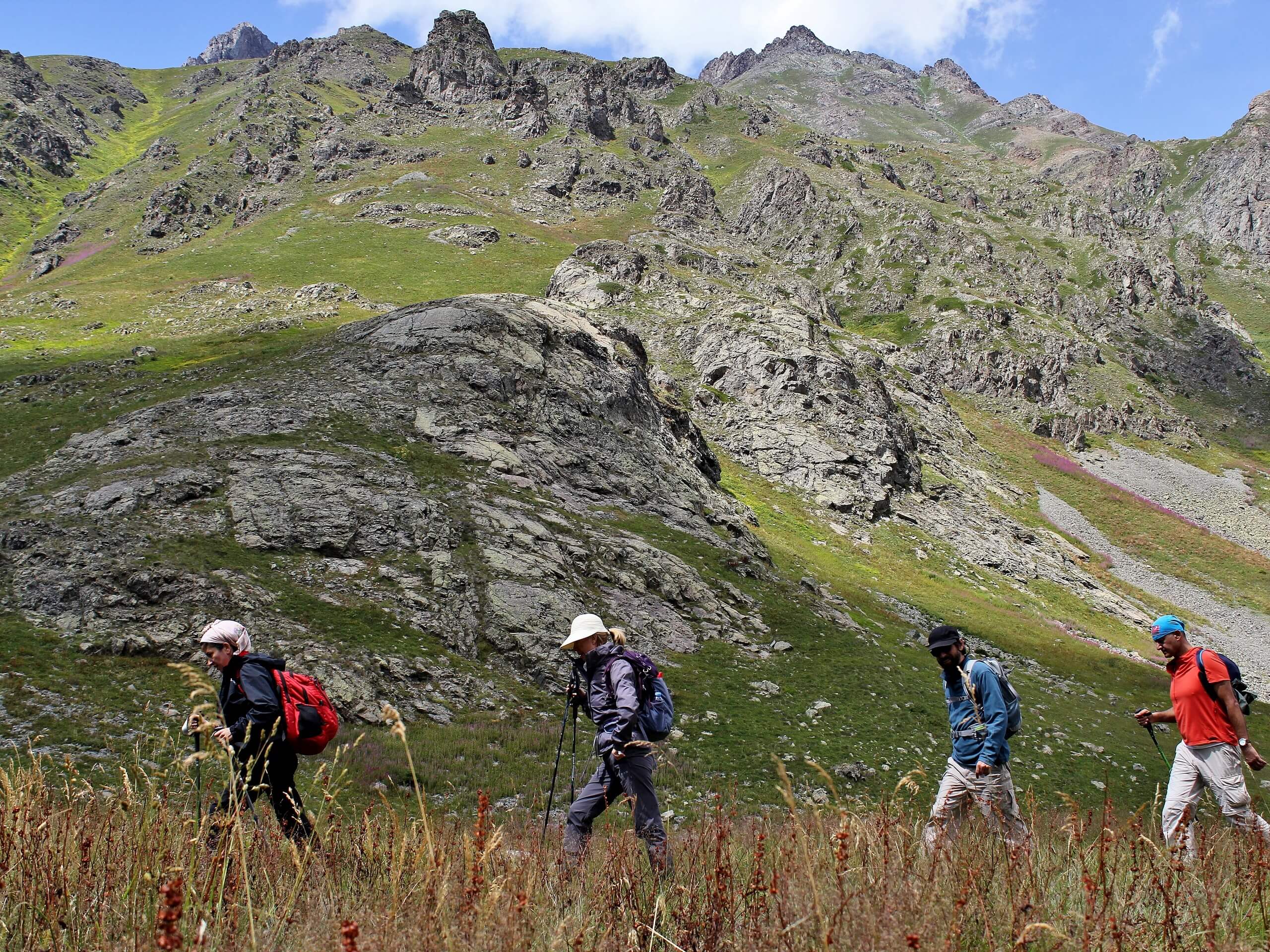 Four trekkers walking in Pontic alps, Turkey