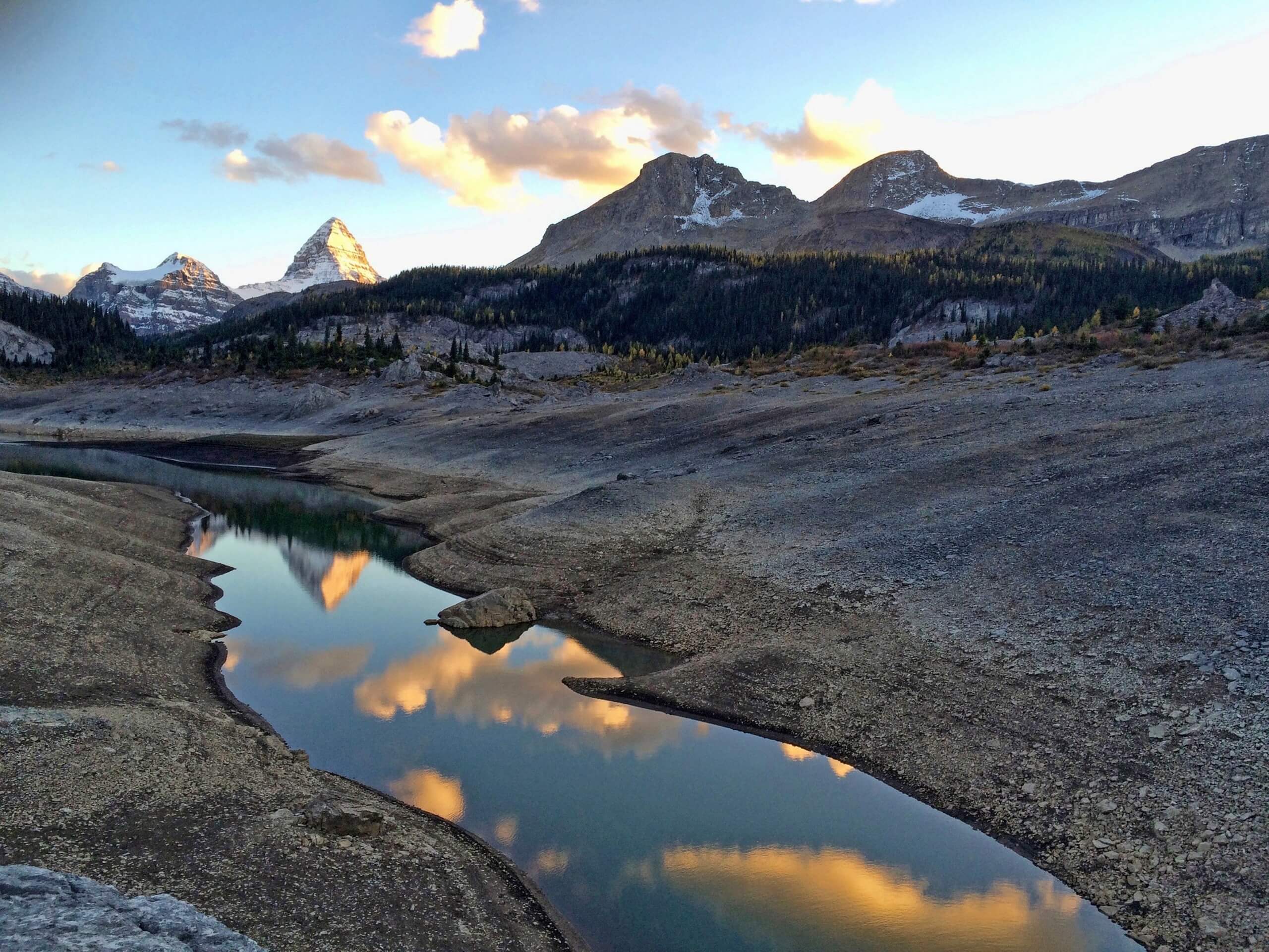 Clouds reflecting in the lake in Assiniboine Region