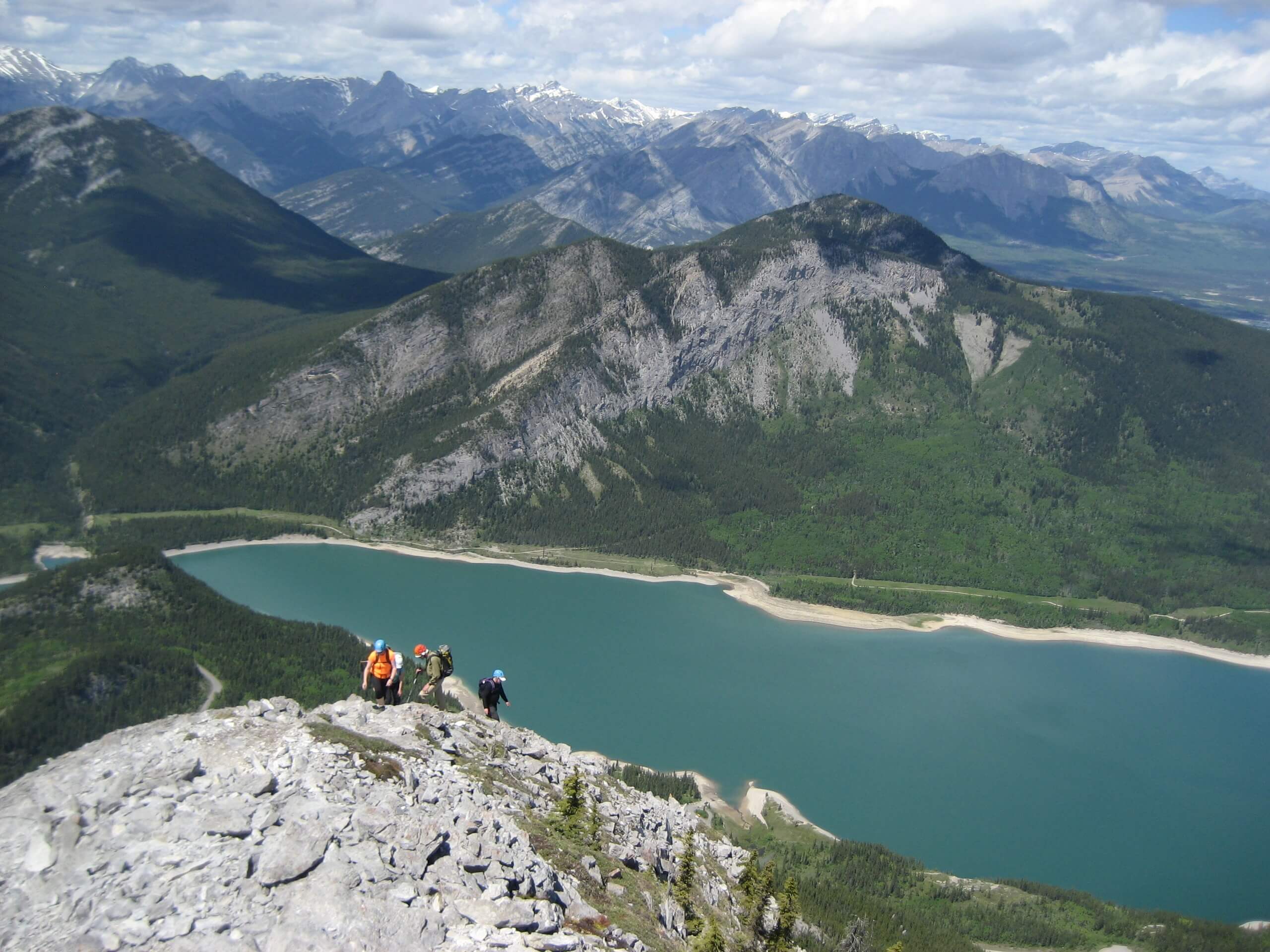 Ascending to the mountain top with a turquoise lake in the background