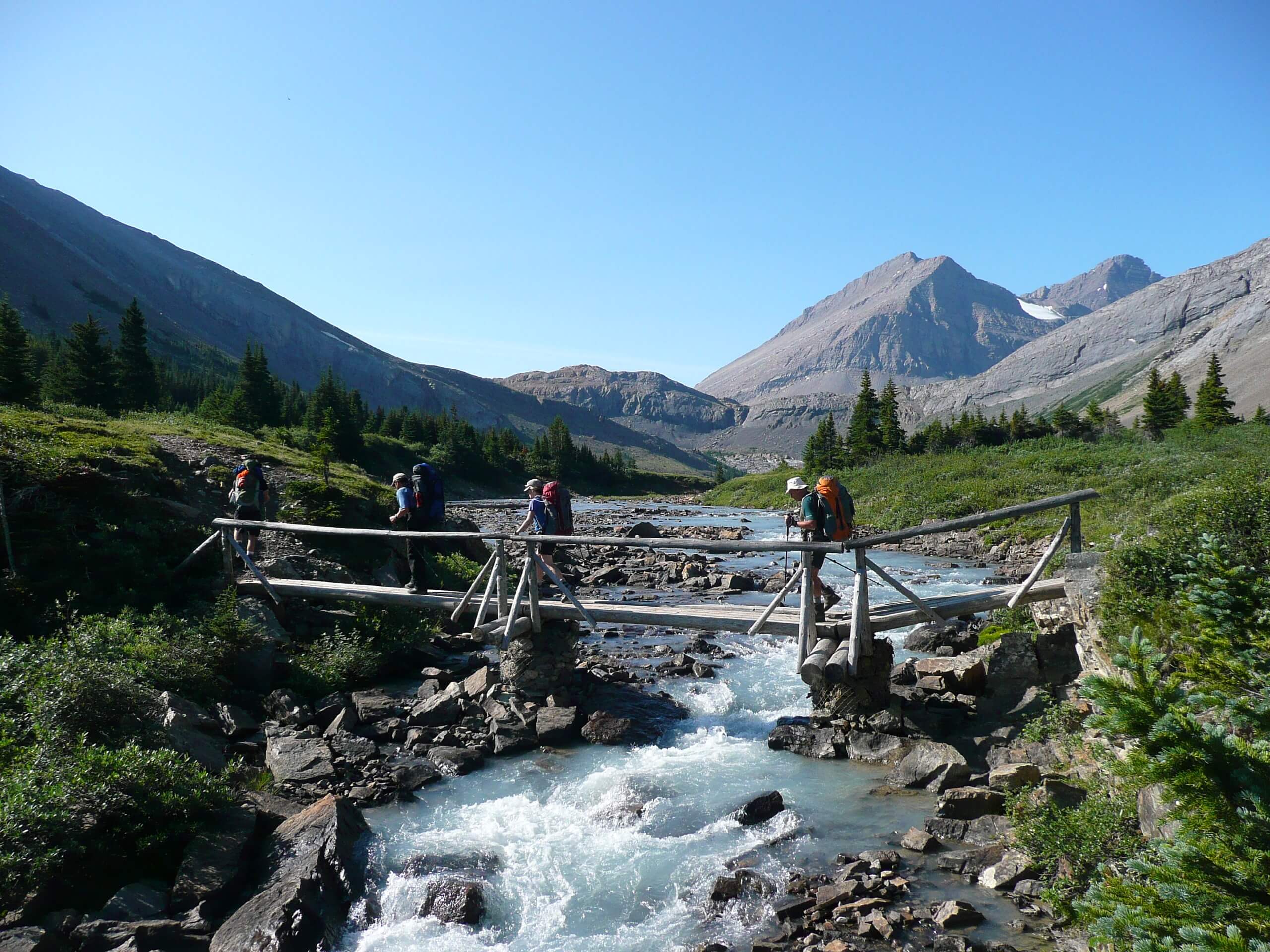 Group of hikers crossing the bridge in Jasper