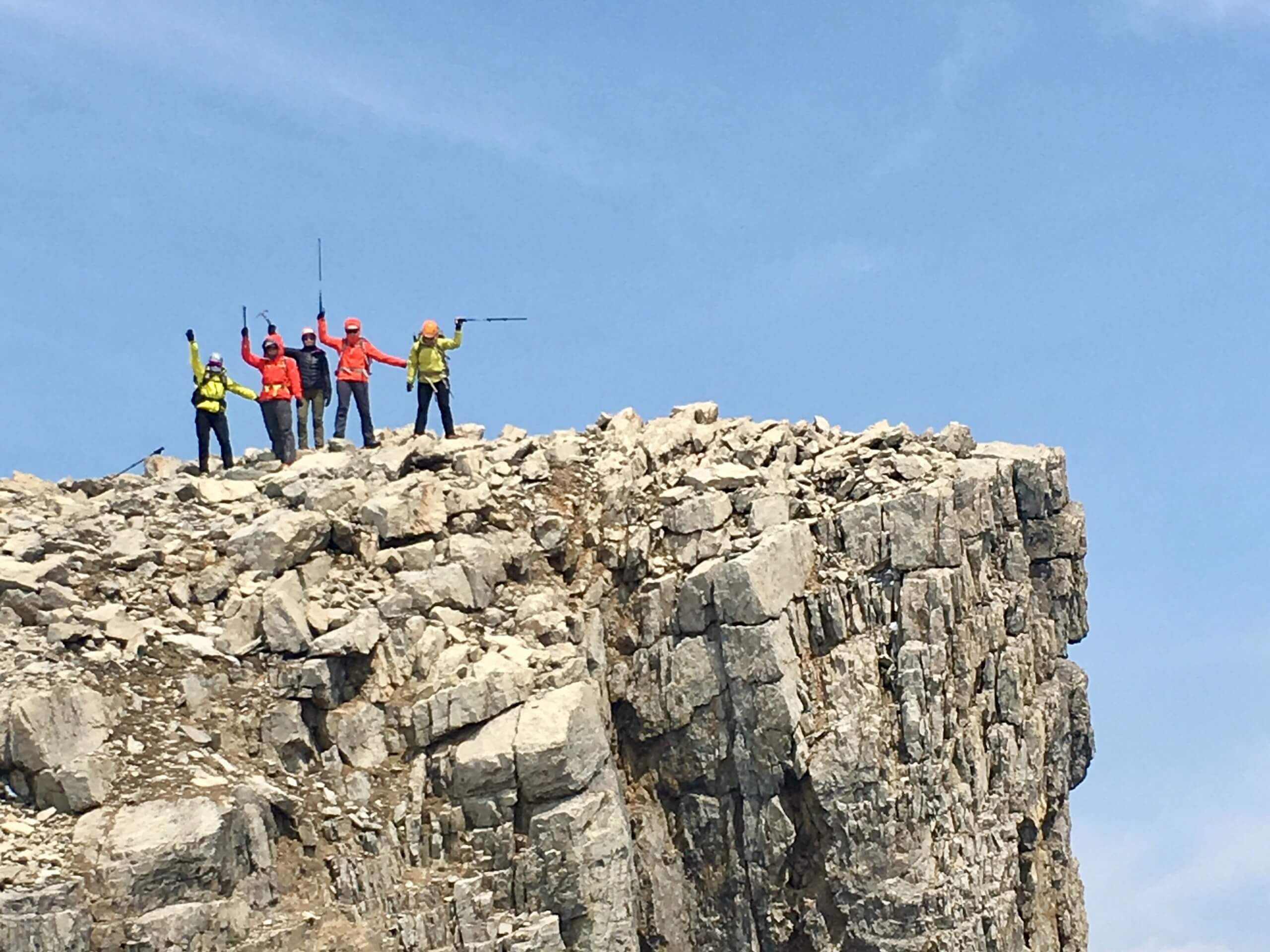 Group of ladies posing on top of the mountain