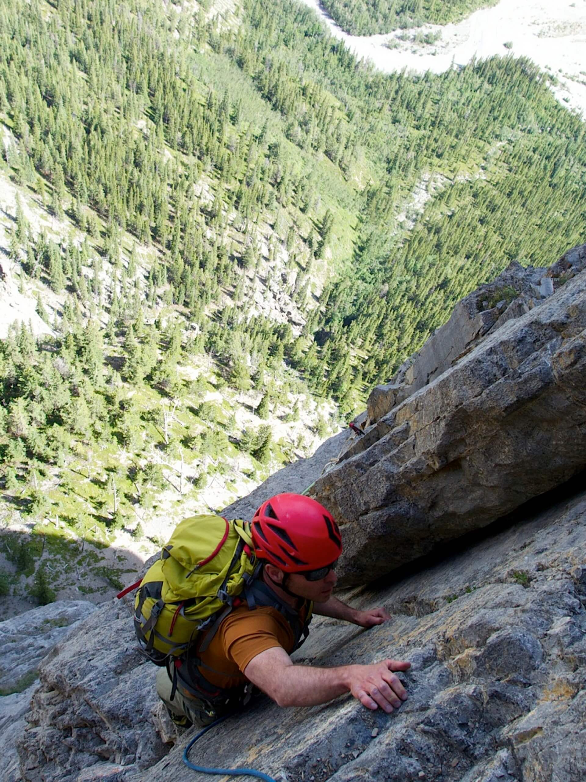 Ascending on a steep rock wall in the Canadian Rockies