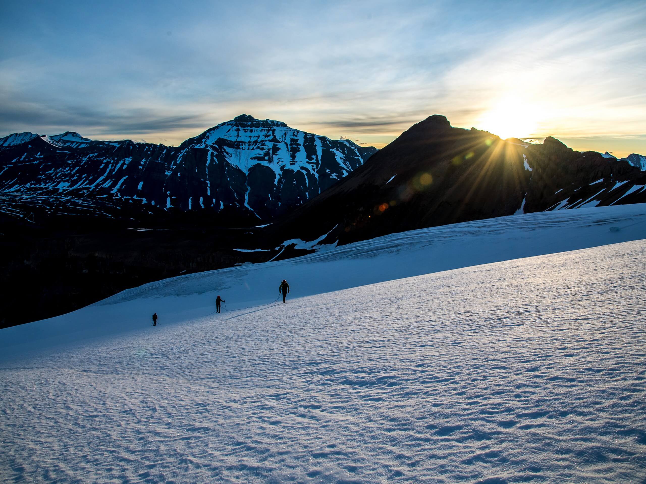 Group of hikers walking on a snow