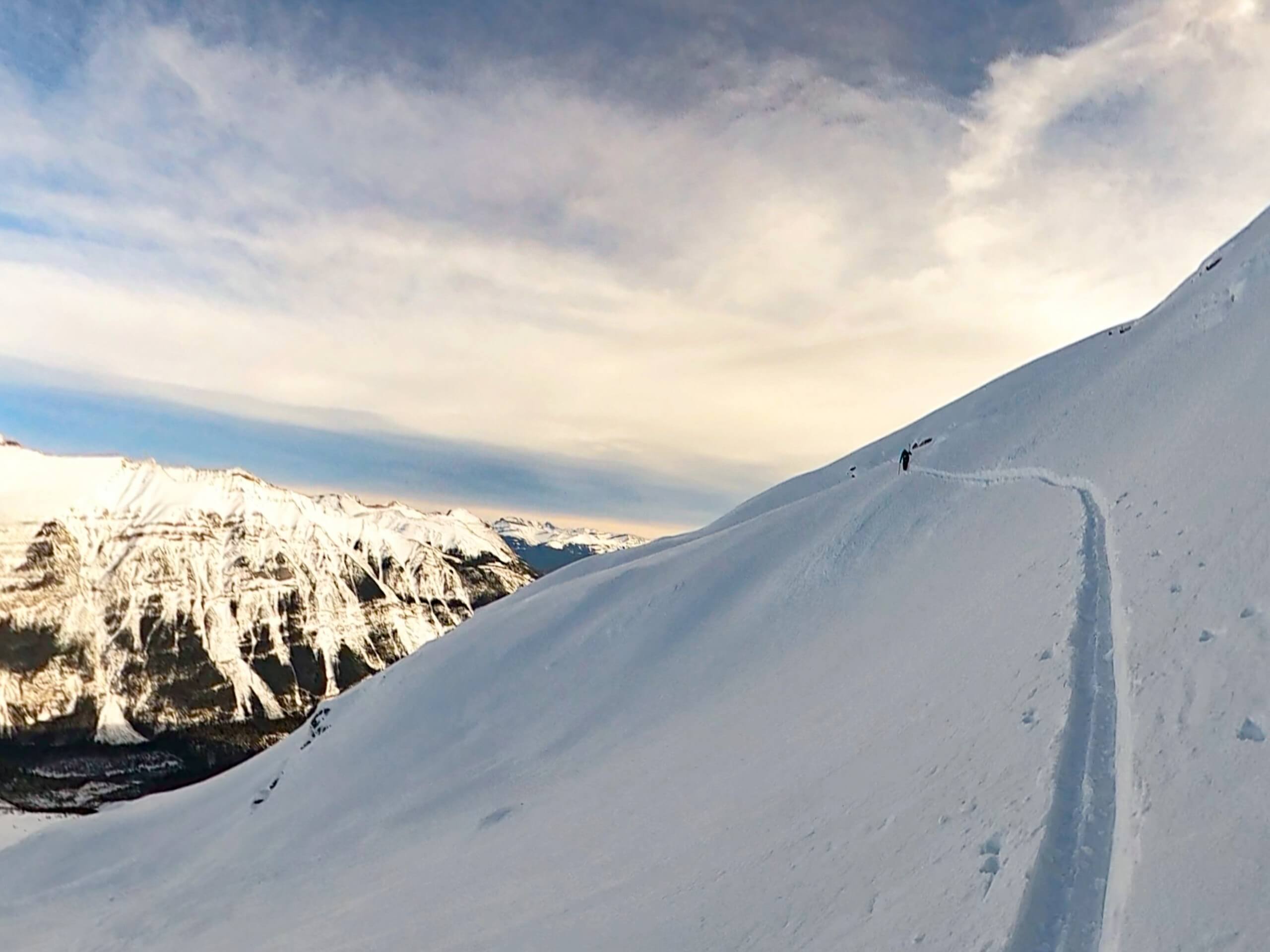 Walking along the snowy ridge in the Canadian Rockies