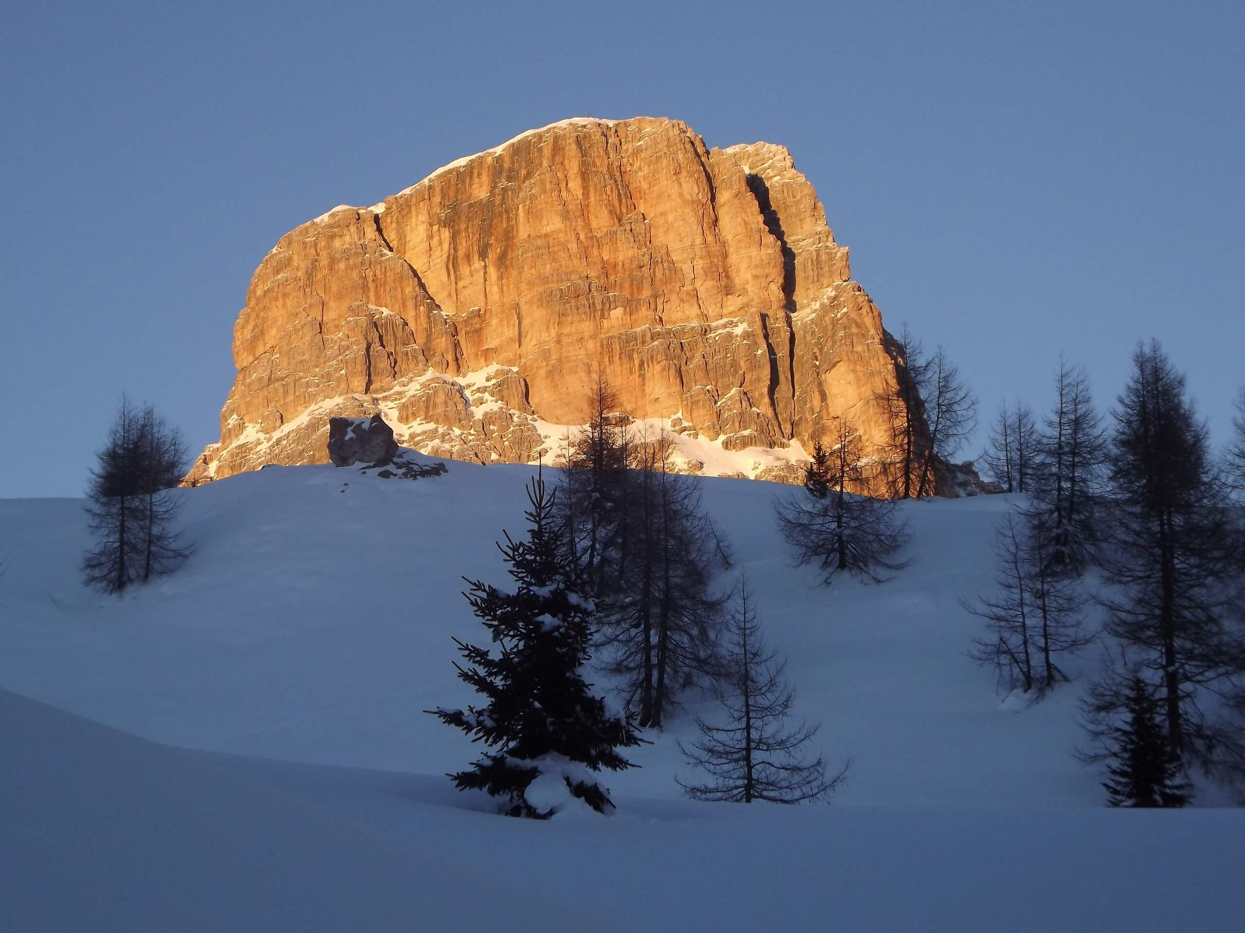 Sun lit mountain in the Italian Dolomites during the winter