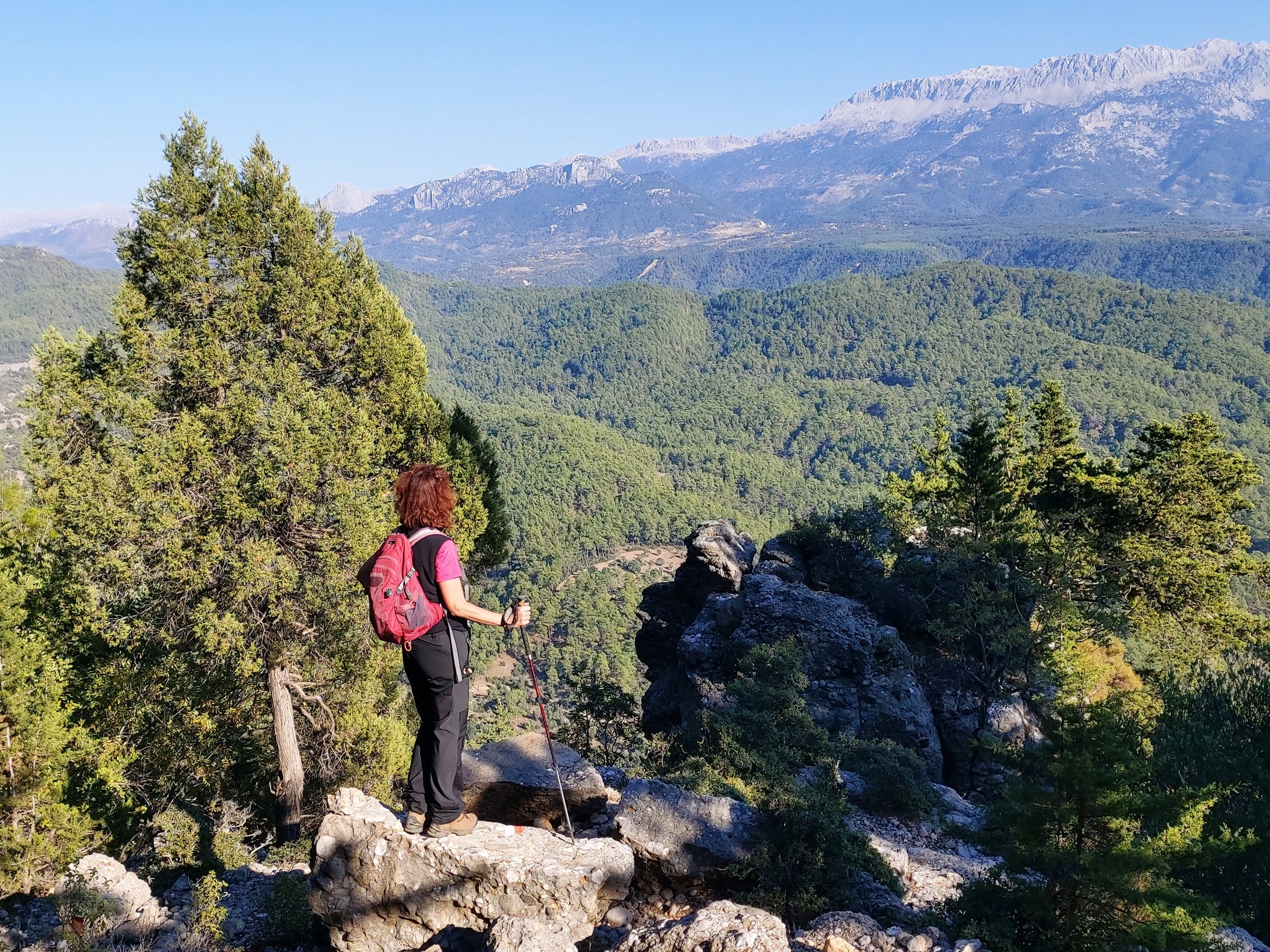 Lady looking down on the beautiful valley while on St Paul Trail