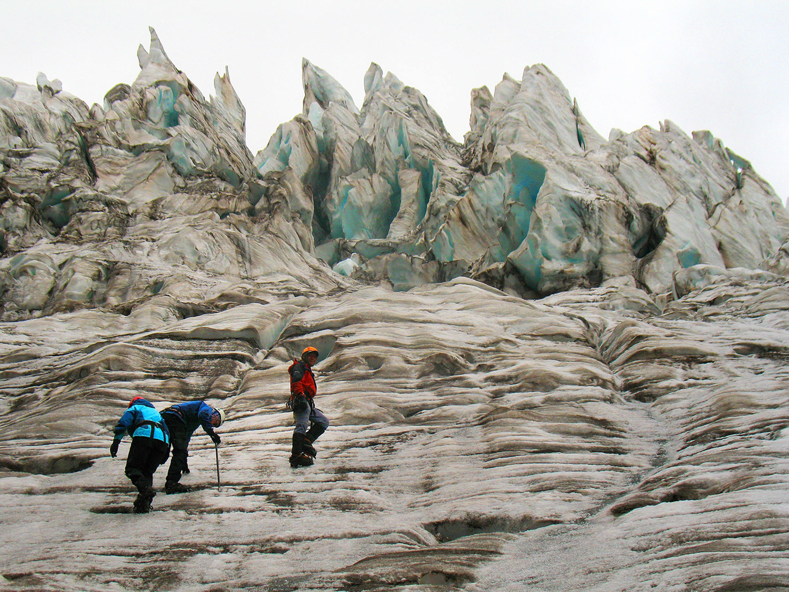 Climbers in Ecuador below icy formations
