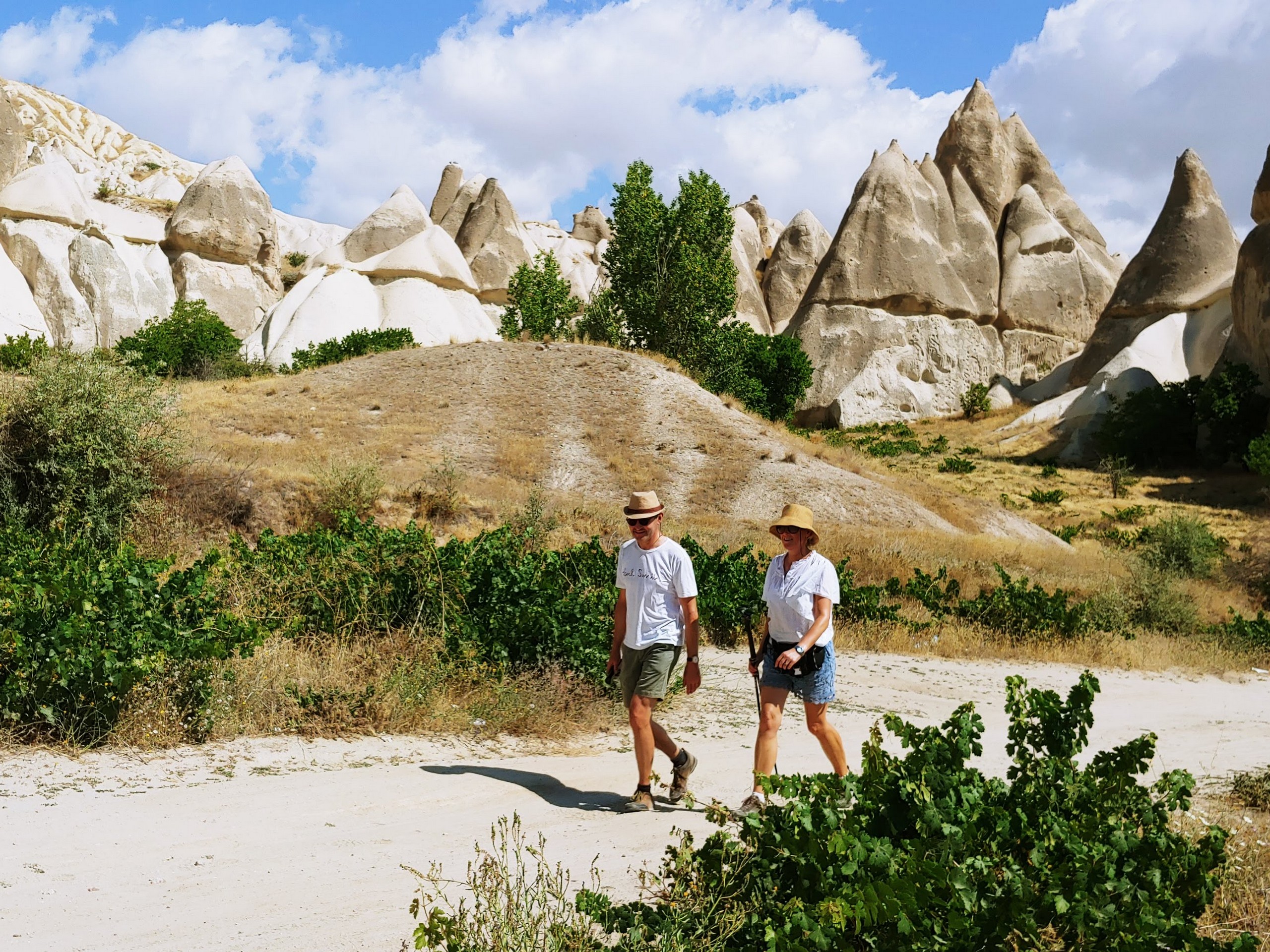 Two hikers exploring the Cappadocian rock formations