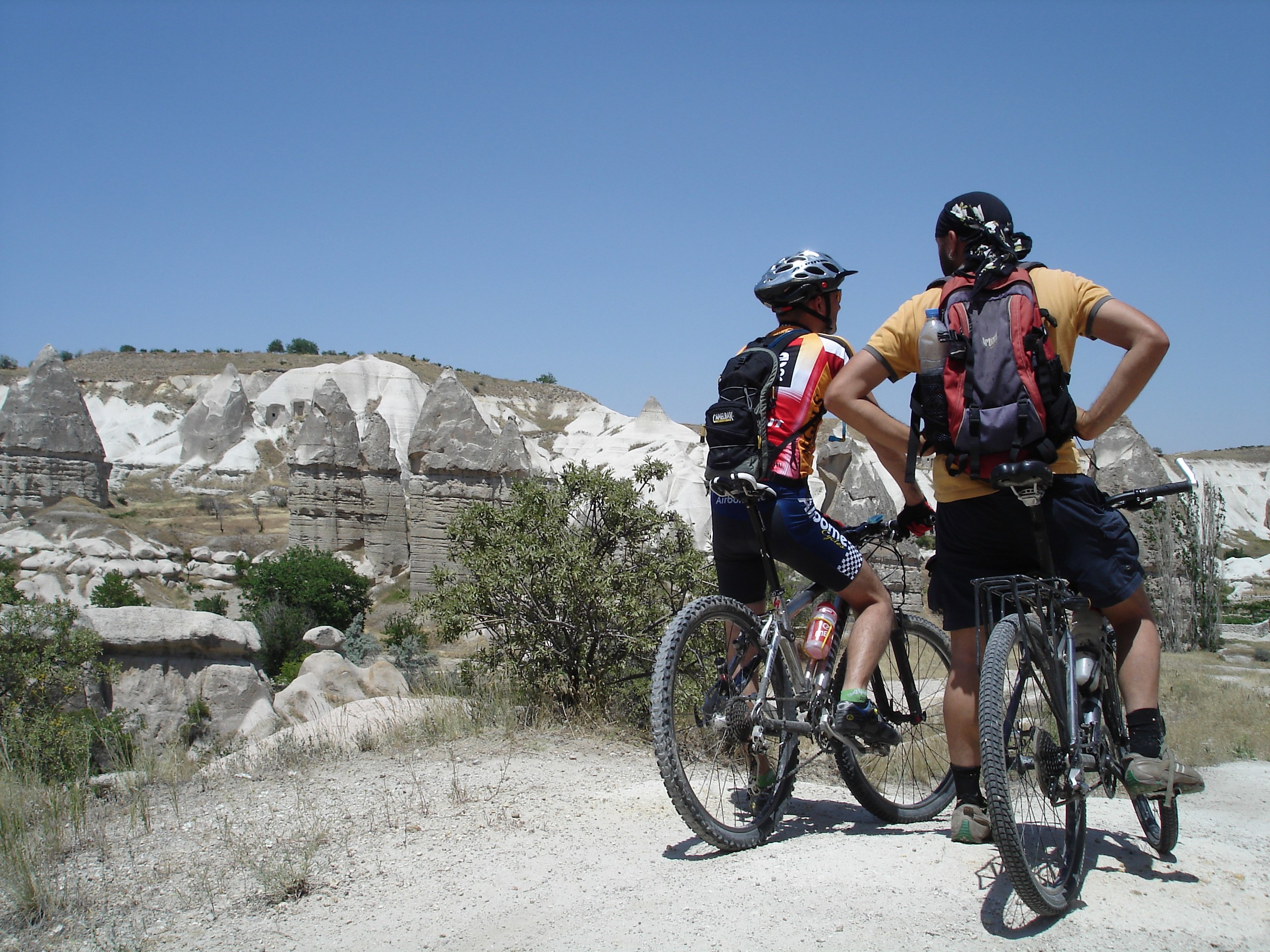 Two bikers looking at Cappadocia's rock formations