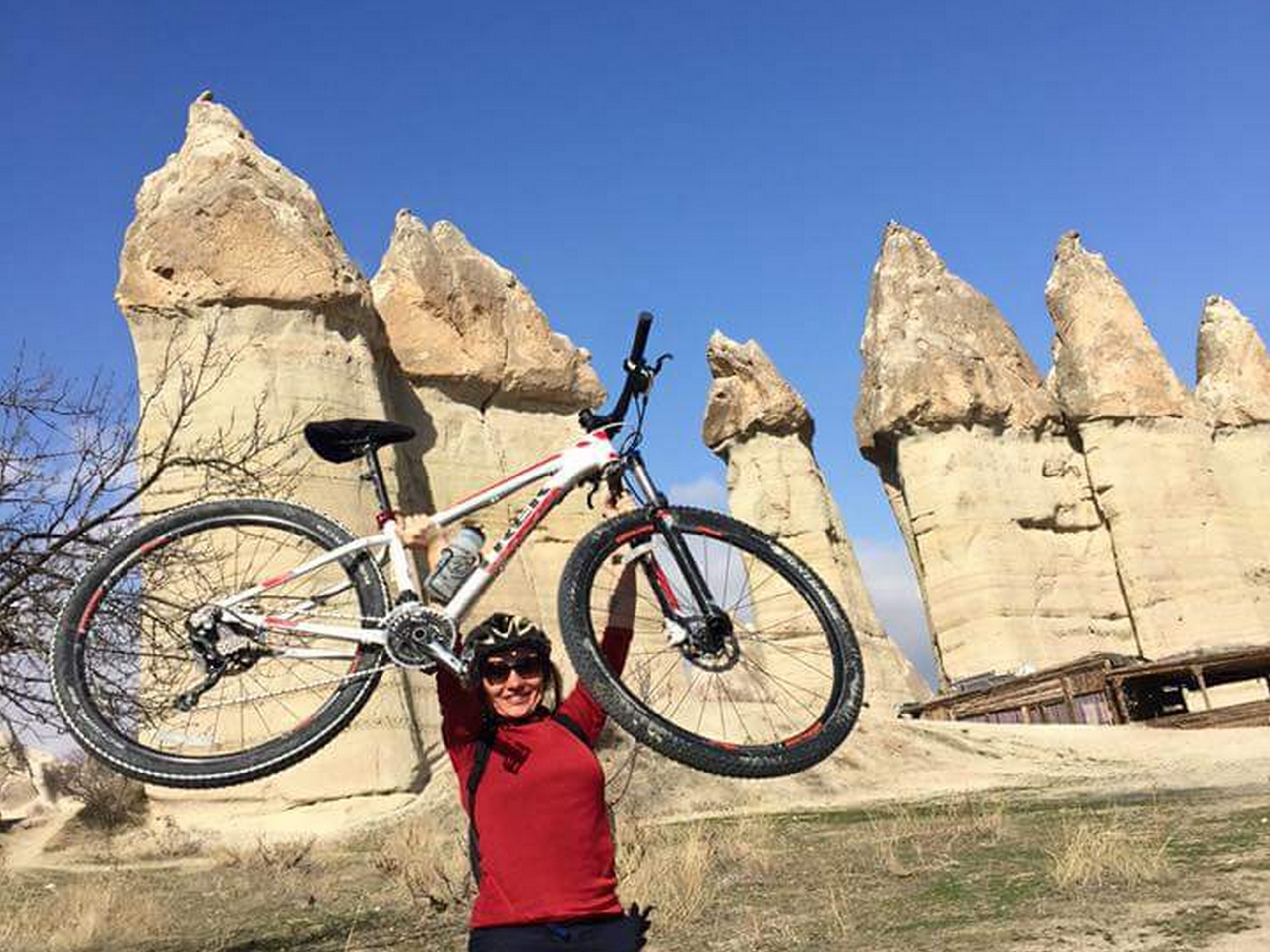 Biker posing with her bike in Cappadocia
