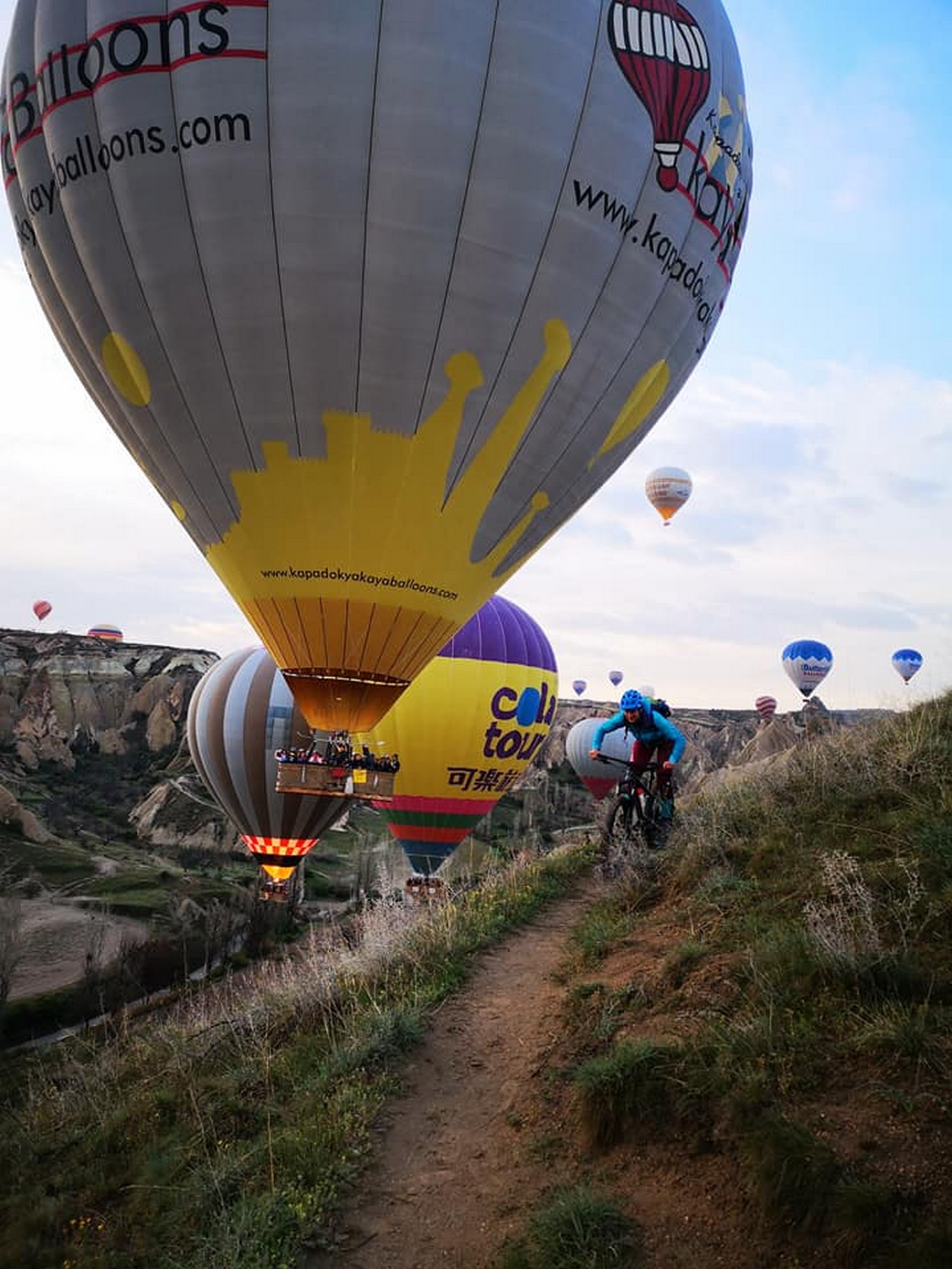 Biking in front of the hot air baloons