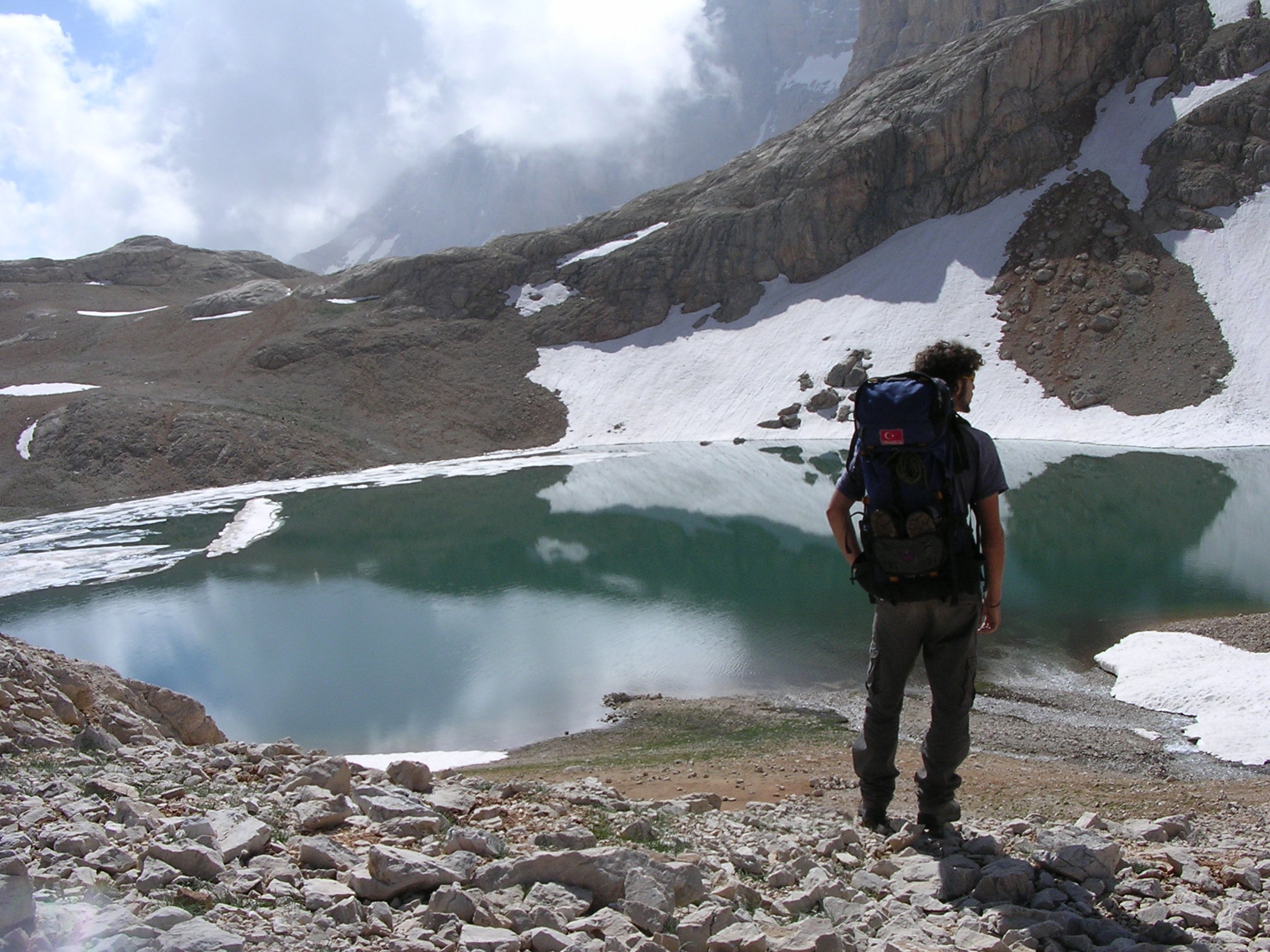 Trekker near small tarn in Kackar Mountains