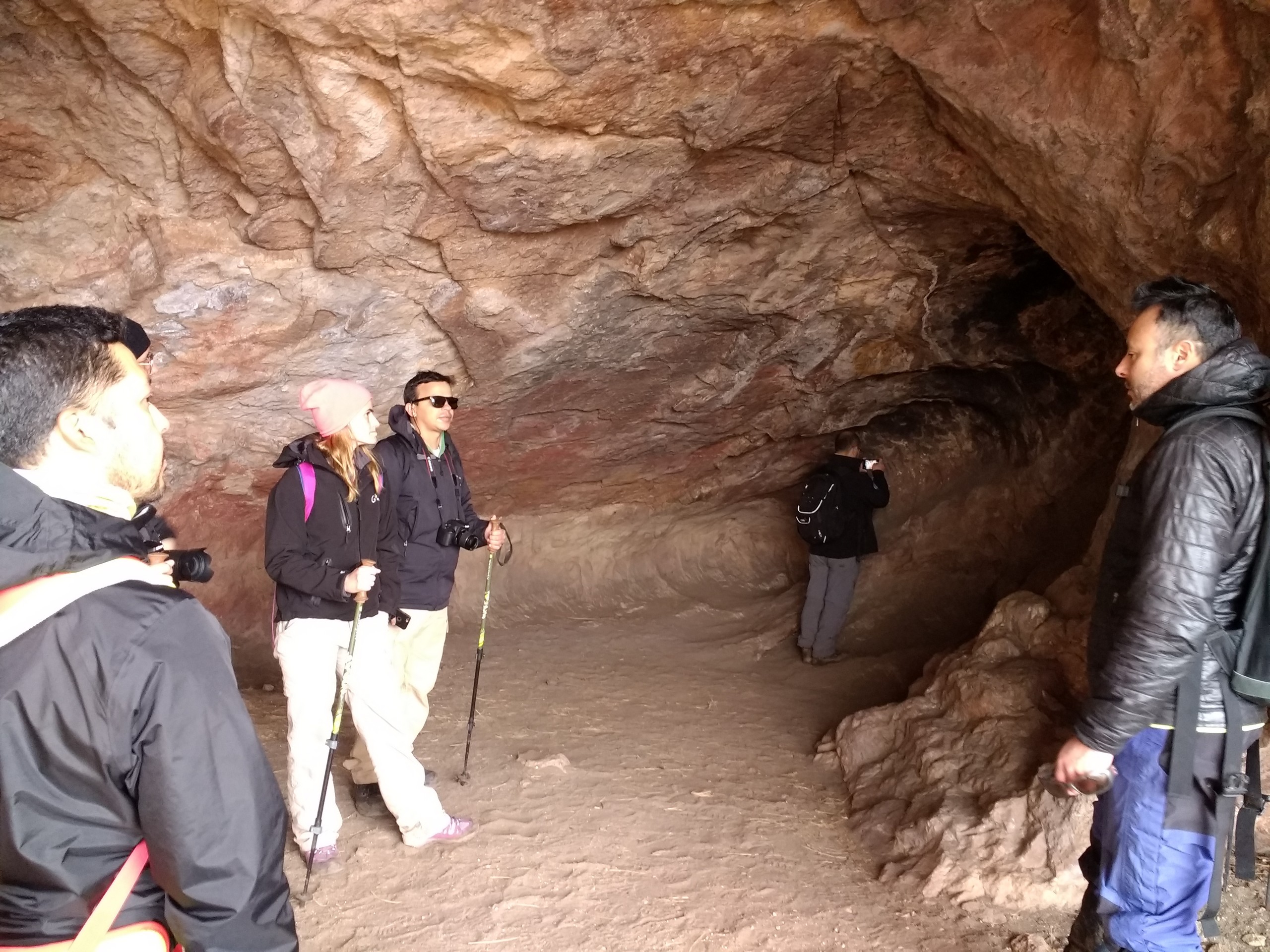 Group of hikers exploring the cave in Chile