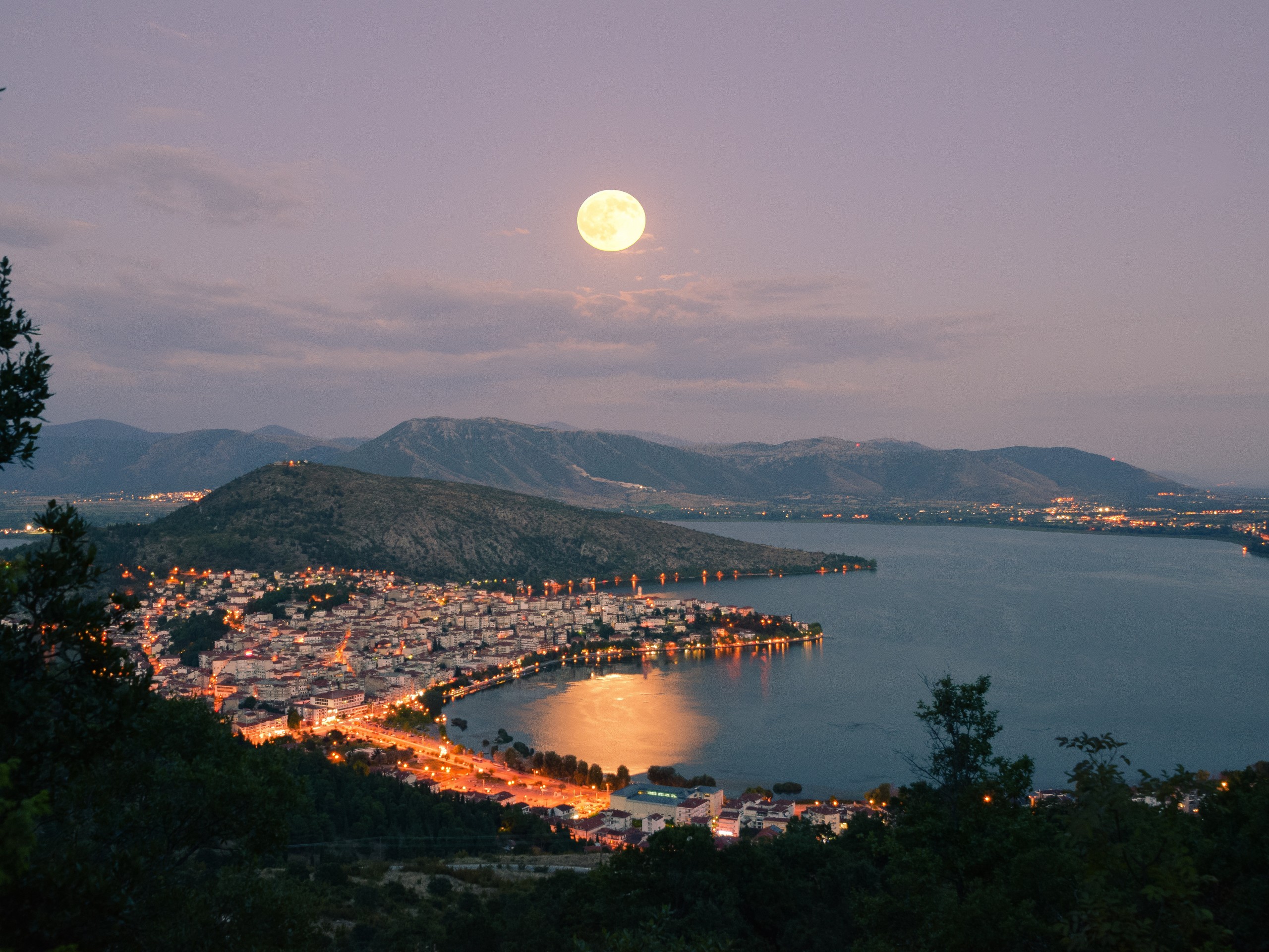 Beautiful Greece city below the full moon