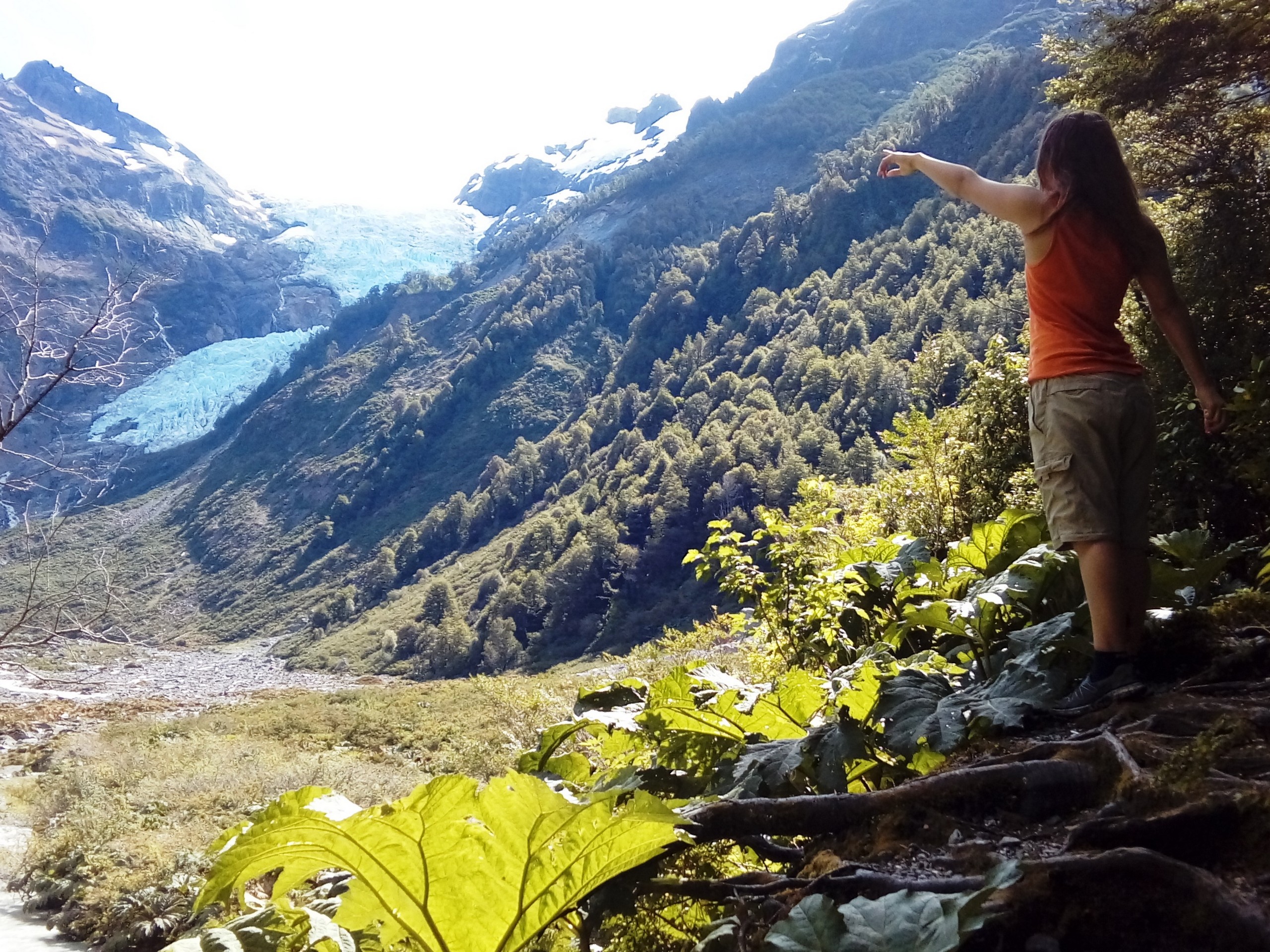Girl pointing a finger at Yelcho Glacier
