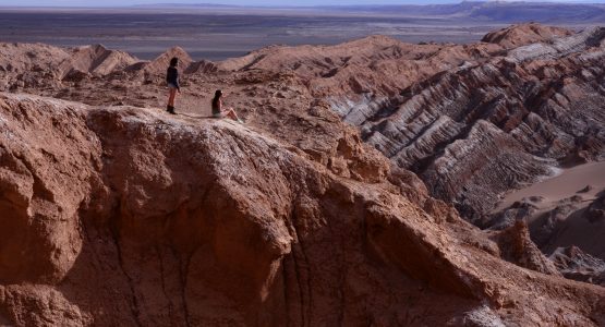 Couple sitting at top of the Moonvalley