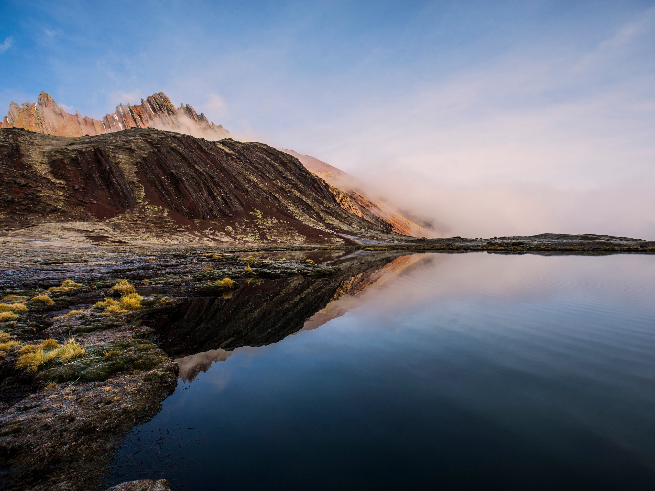 Humpoccocha lagoon seen while trekking in the Andean Mountains with a guide