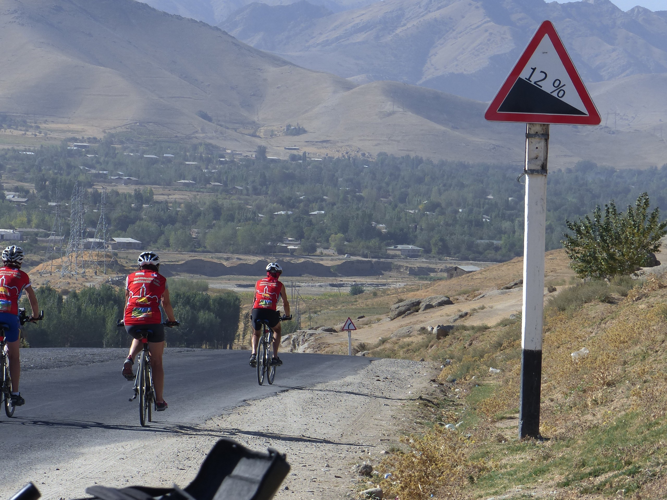 Cyclists riding down the hill in Uzbekistan