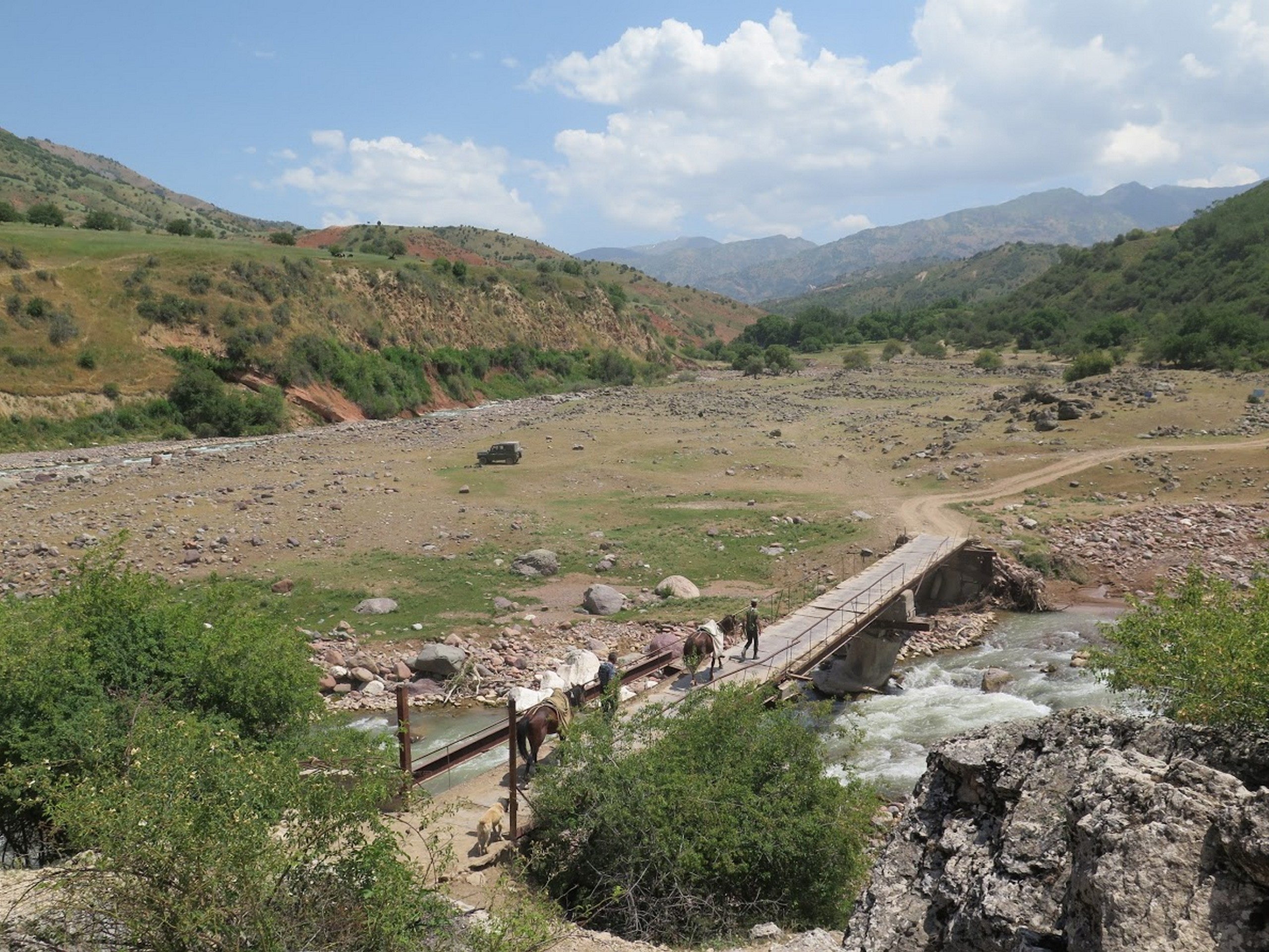 Looking down at the beautiful valley and the river crossing in Uzbekistan