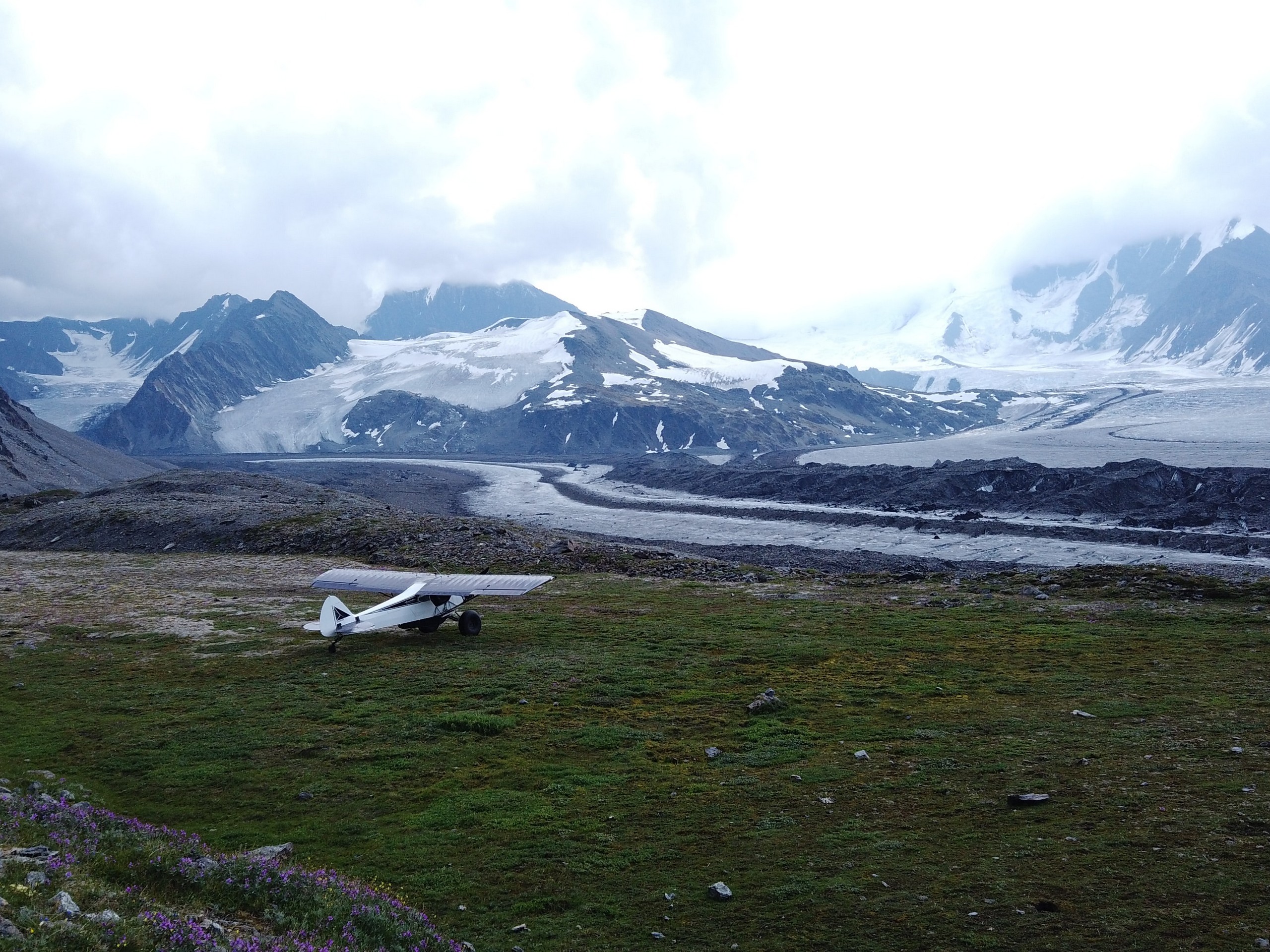 Small plane near a big glacier in Alaska