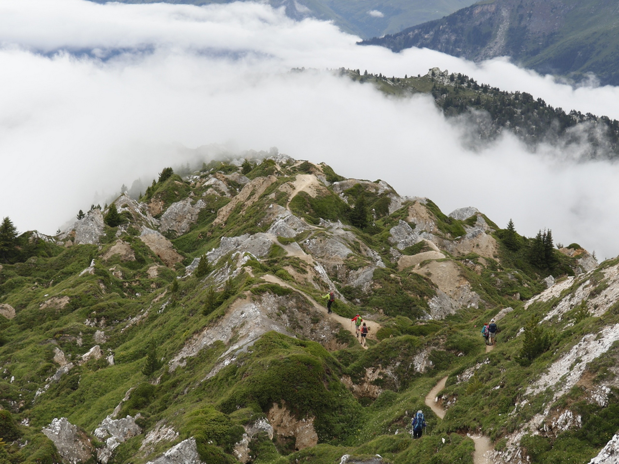 Clouds in the valley below the peaks of Vanoise